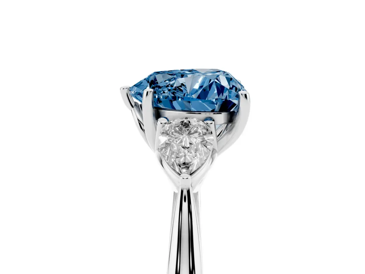 Fancy Blue Three-Stone Heart Cut Diamond Ring with Pear Side Stones in Four-Prong Setting Silver