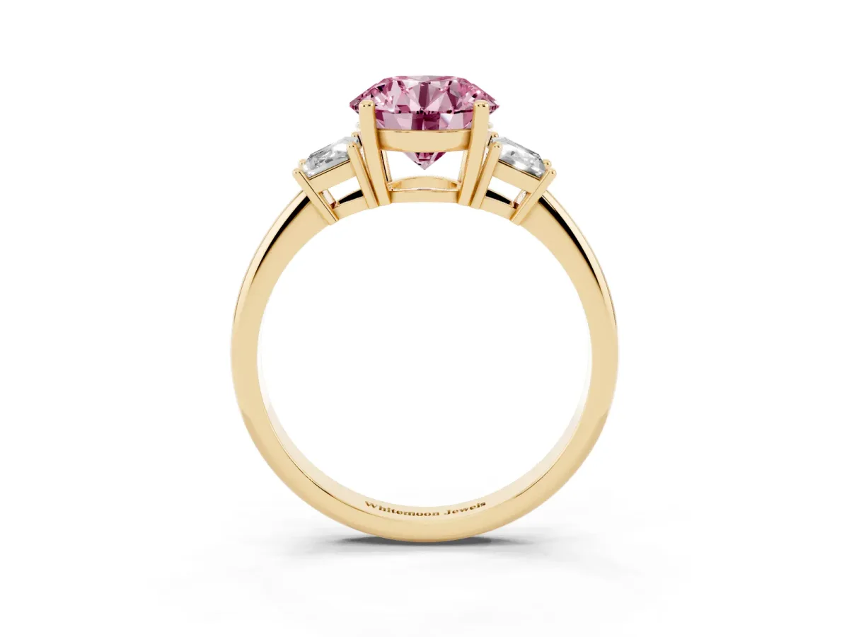 Fancy Pink Round Cut Diamond Three-Stone Ring with Trapezoid Side Stones and Prong Setting Yellow gold