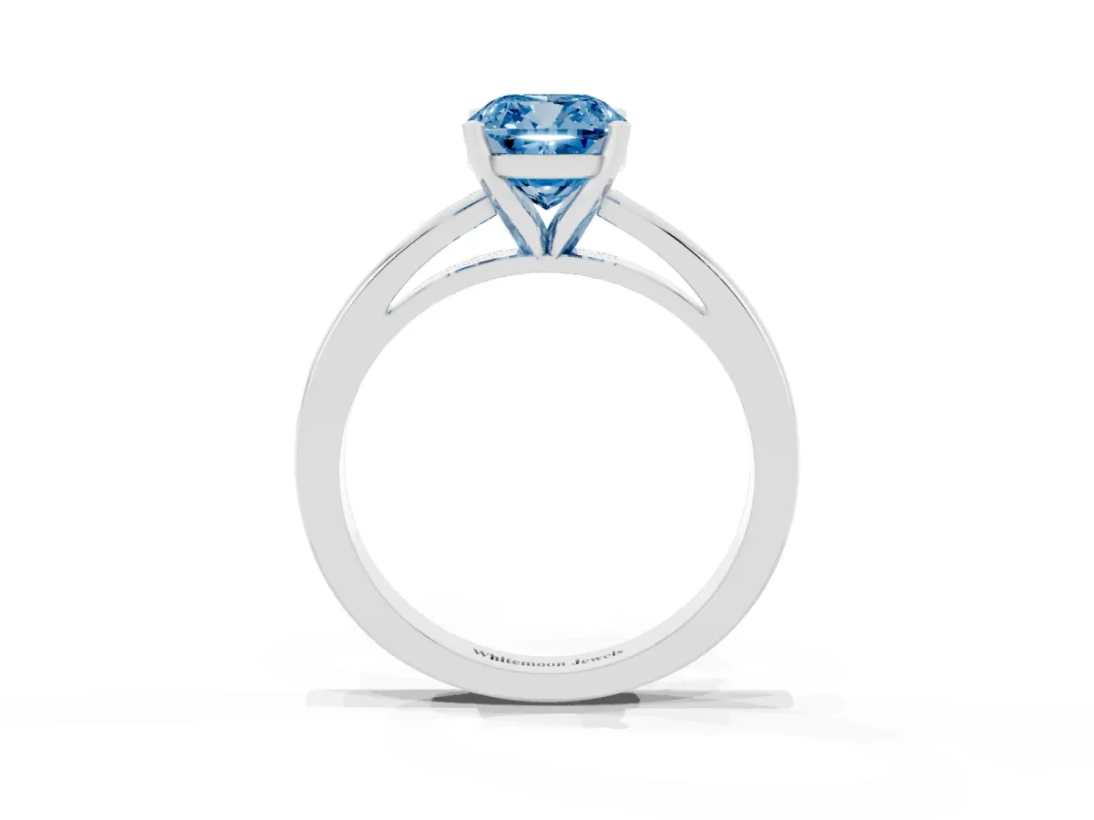 Fancy Blue Cushion Cut Solitaire Diamond Engagement Ring with Four-Prong Setting on a Classic Band Platinum