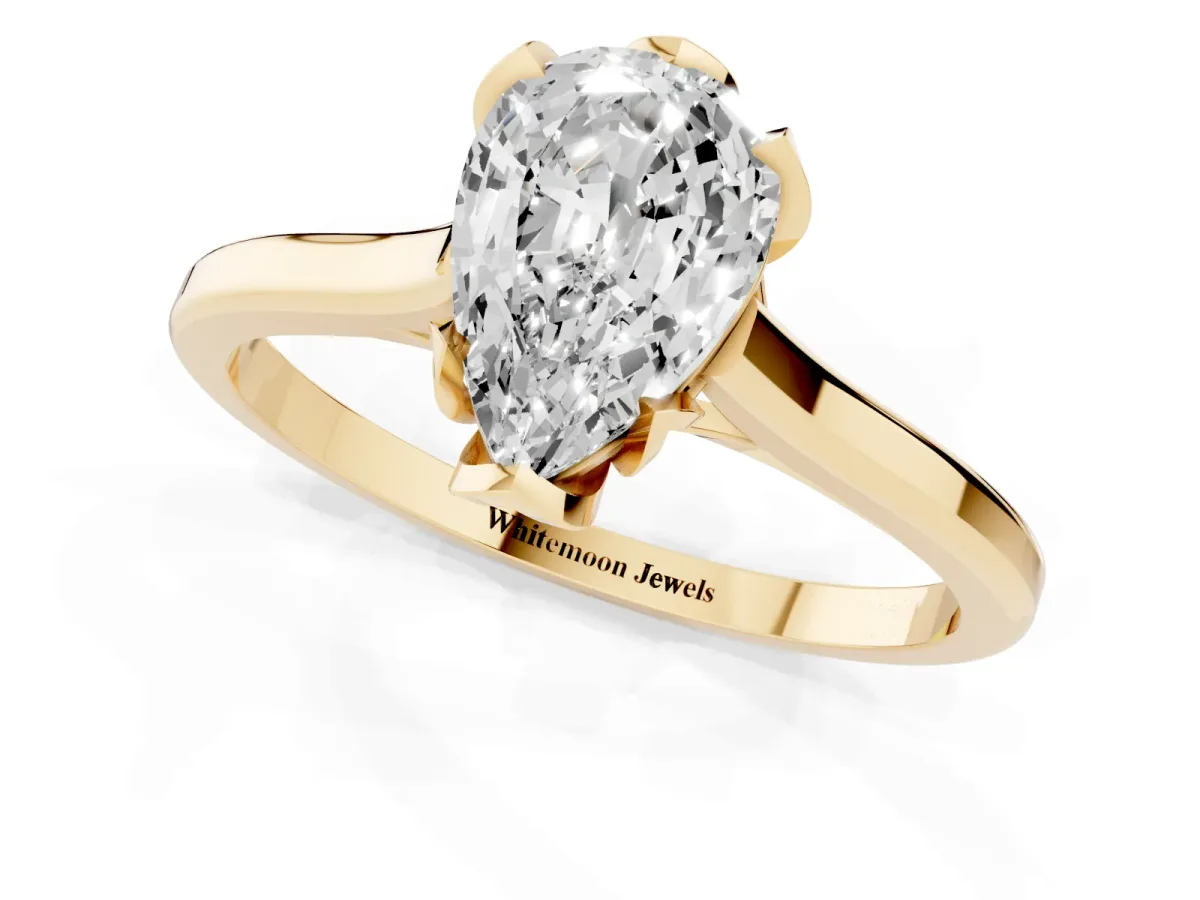 Pear Cut Diamond Solitaire Ring with Flower Prong Setting and Classic Band Yellow gold