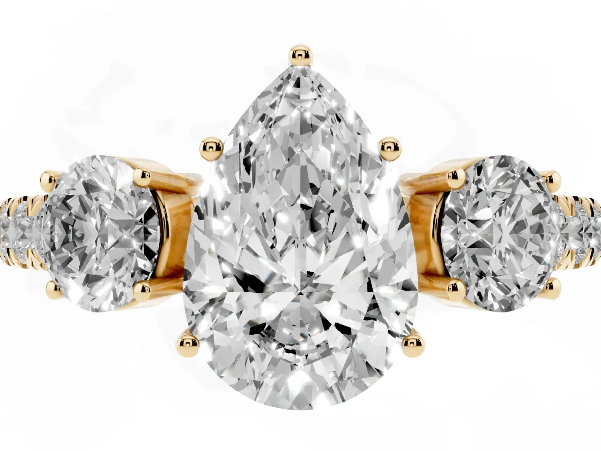 Pear Cut Cut Diamond Three-Stone Ring with Round Side Stones and Pavé Band Yellow gold
