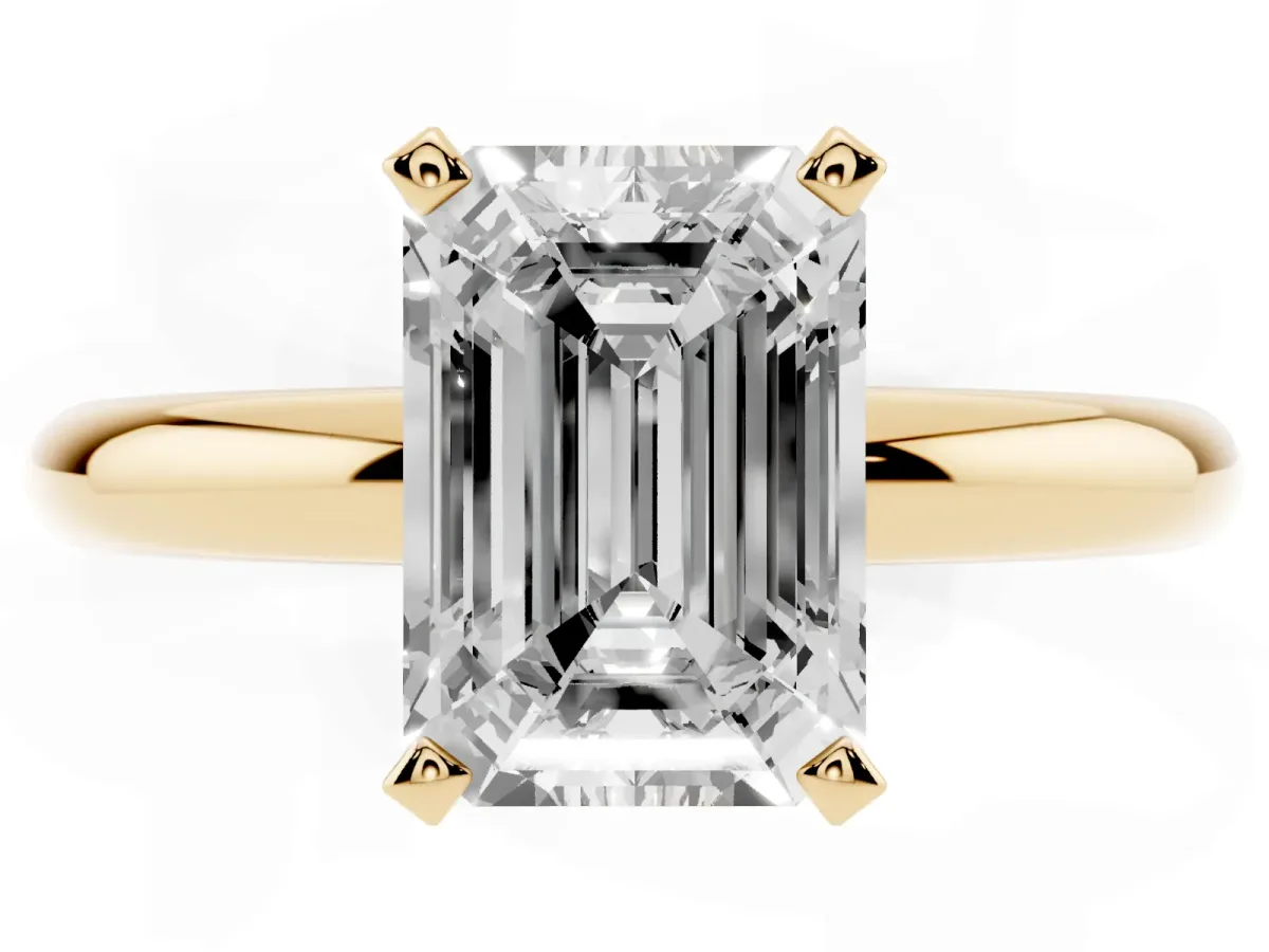 Emerald Cut Diamond Solitaire Engagement Ring with Round Band and Four-Prong Setting Yellow gold