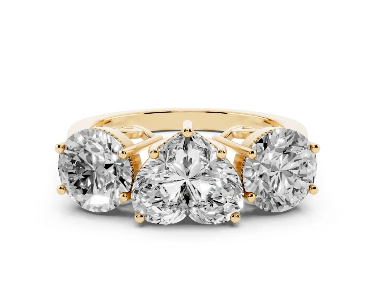 Three-Stone Heart Cut Diamond Engagement Ring with Prong Setting on a Classic Band Yellow gold