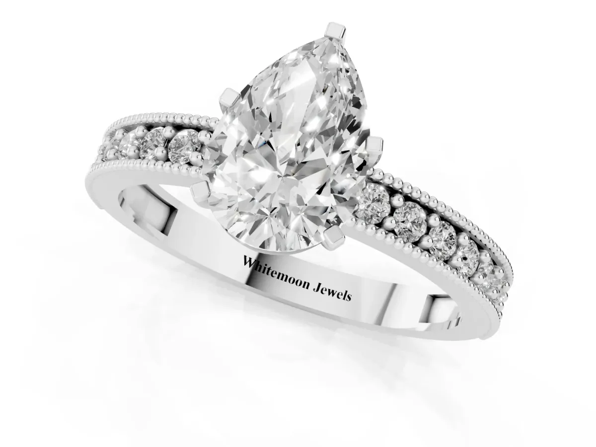 Pear Cut Diamond Milgrain Pavé Engagement Ring with Four-Prong Setting Silver