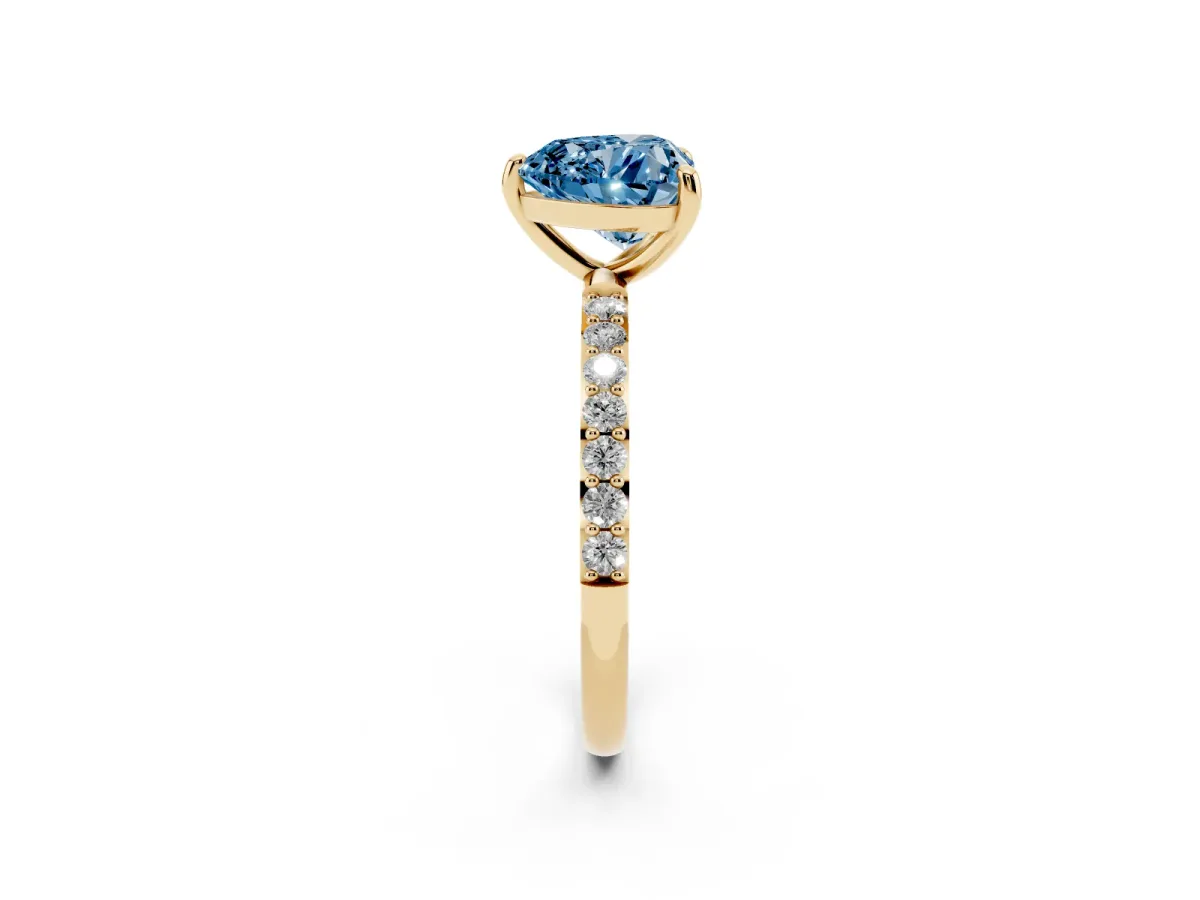 Fancy Blue Heart Cut Diamond Solitaire Ring with Round Pavé Band and Prong Setting Yellow gold