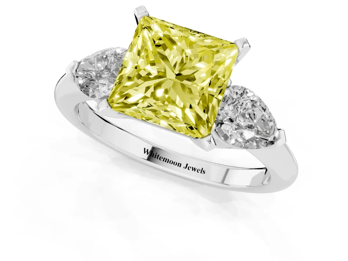 Fancy Yellow Three-Stone Princess Cut Diamond Ring with Pear Side Stones and Four-Prong Setting Silver
