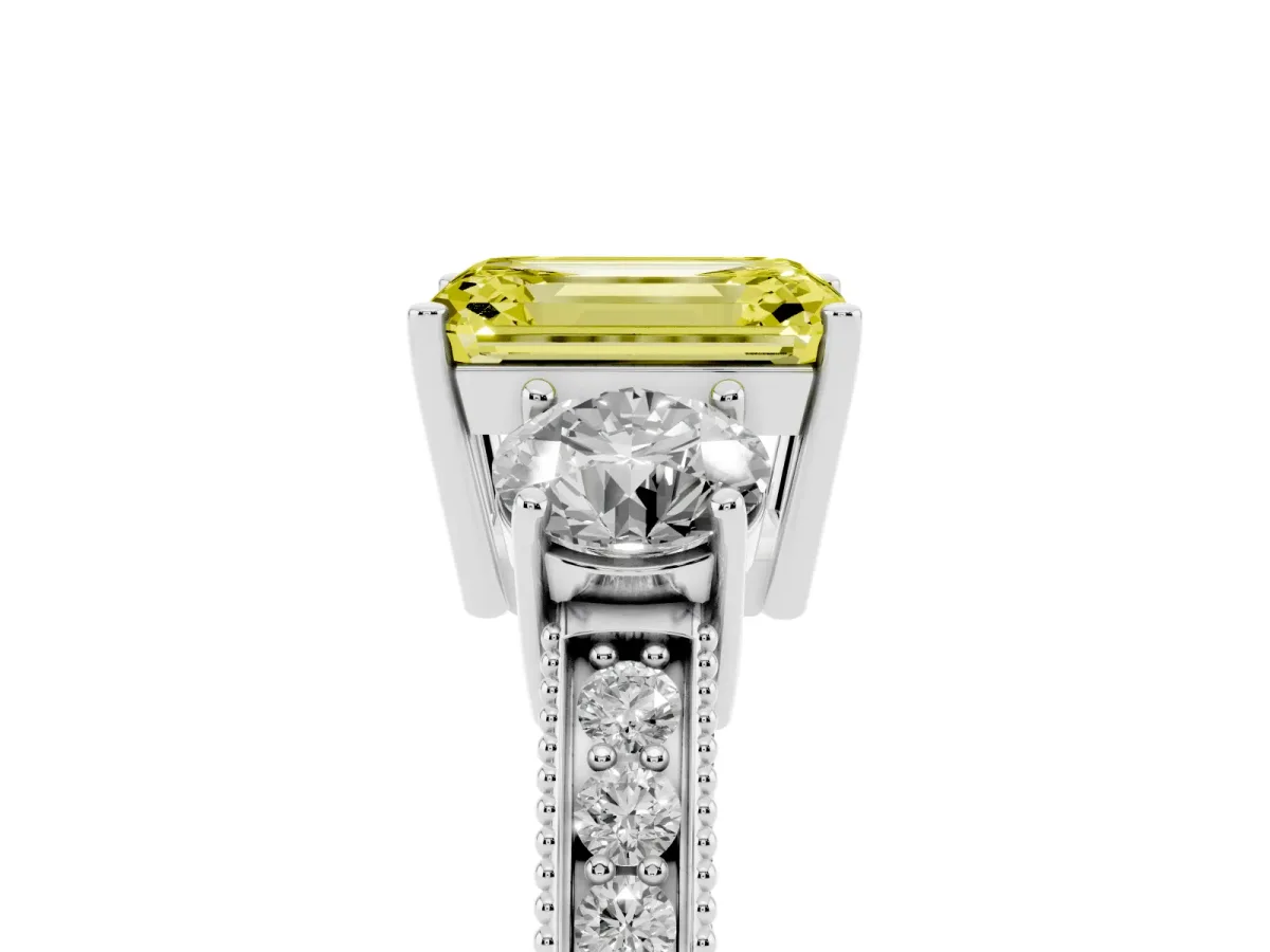 Fancy Yellow Emerald Cut Three-Stone Diamond Ring with Pavé Band and Four-Prong Setting Platinum