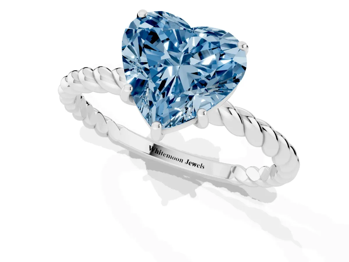 Fancy Blue Heart Cut Solitaire Twist Band Ring with Four-Prong Setting Platinum