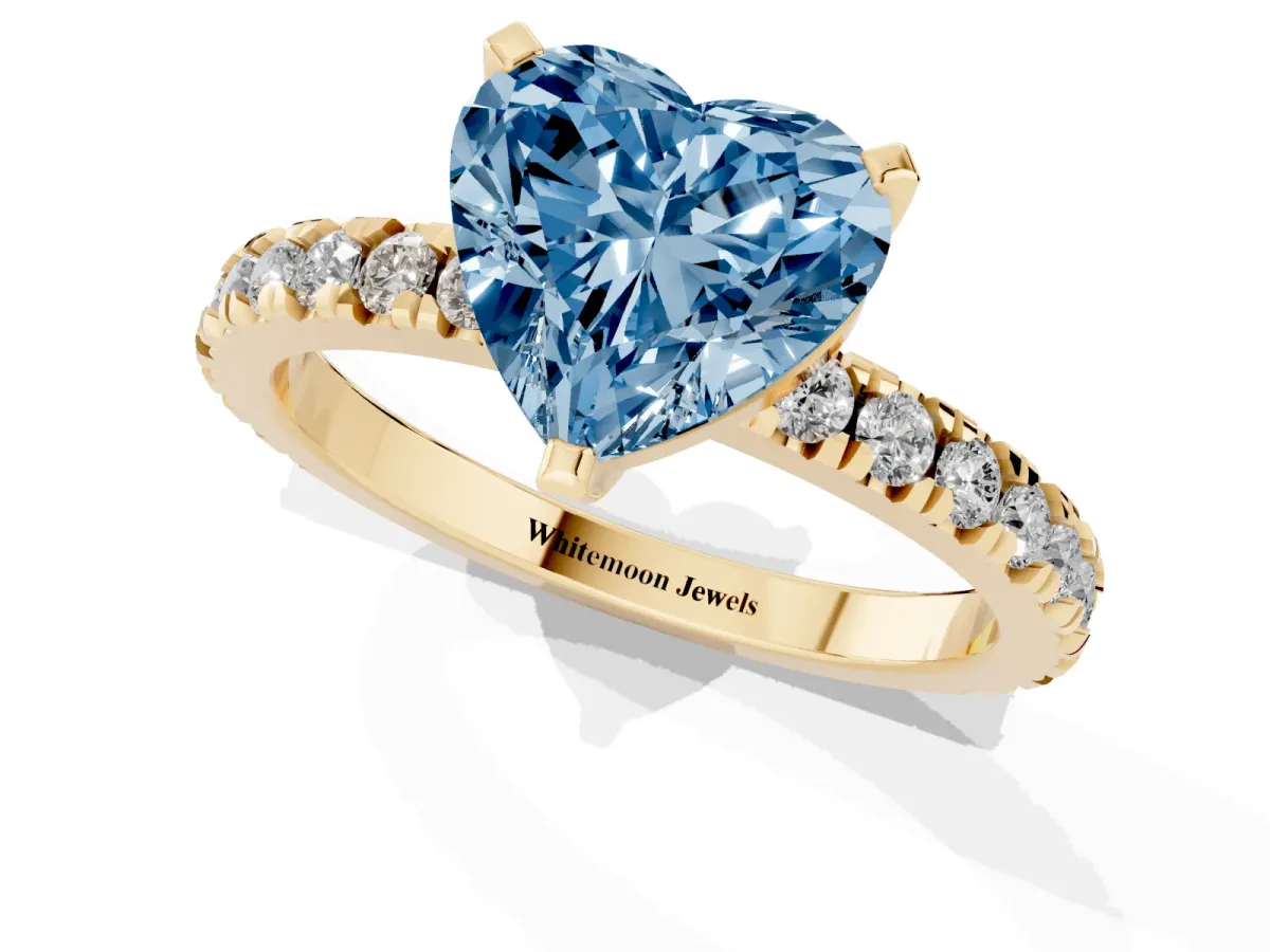 Fancy Blue Heart Cut Diamond Pavé Band Solitaire with Four-Prong Setting Yellow gold