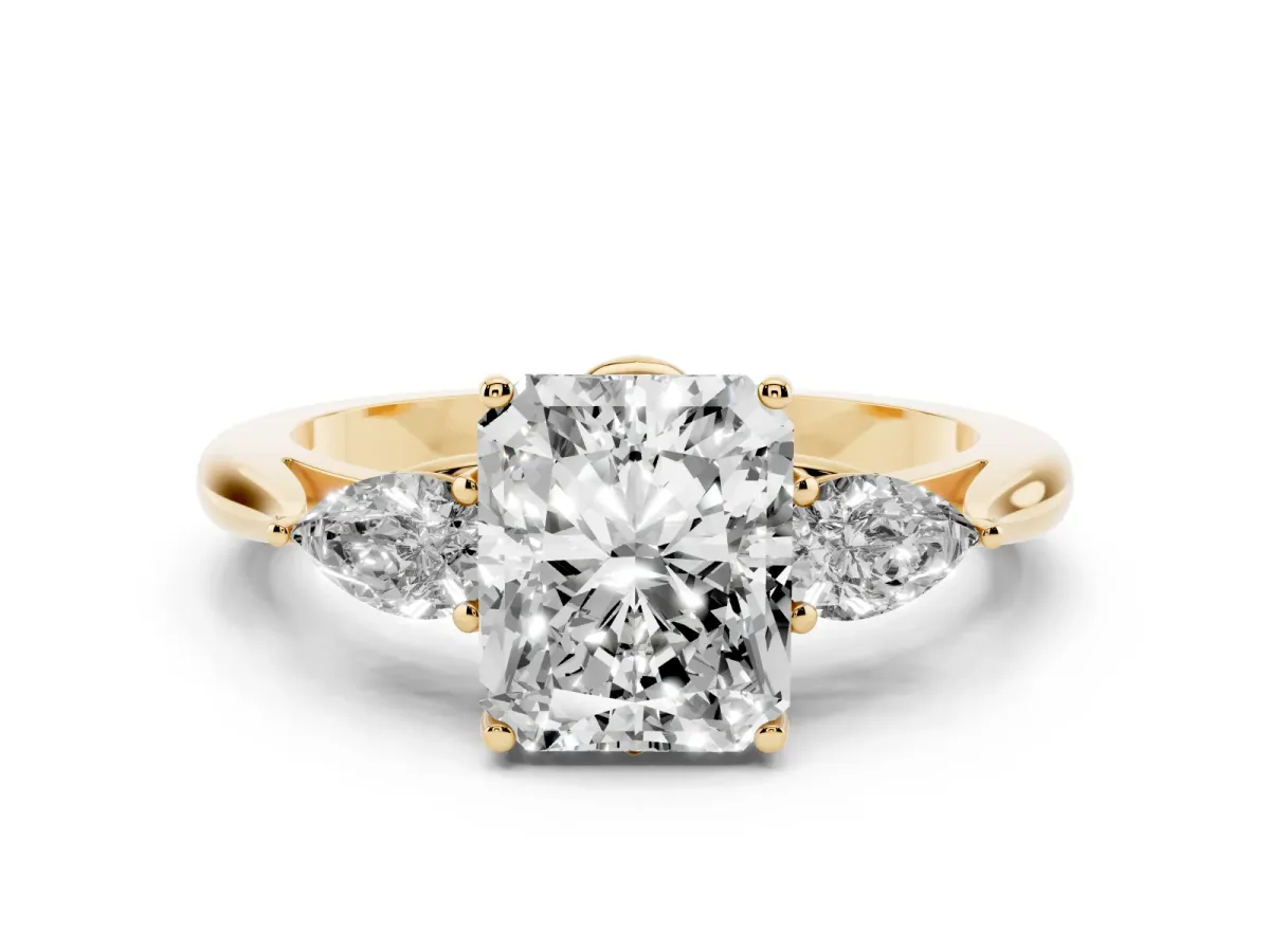 Radiant Cut Diamond Three-Stone Ring with Pear Side Stones and Prong Setting Yellow gold