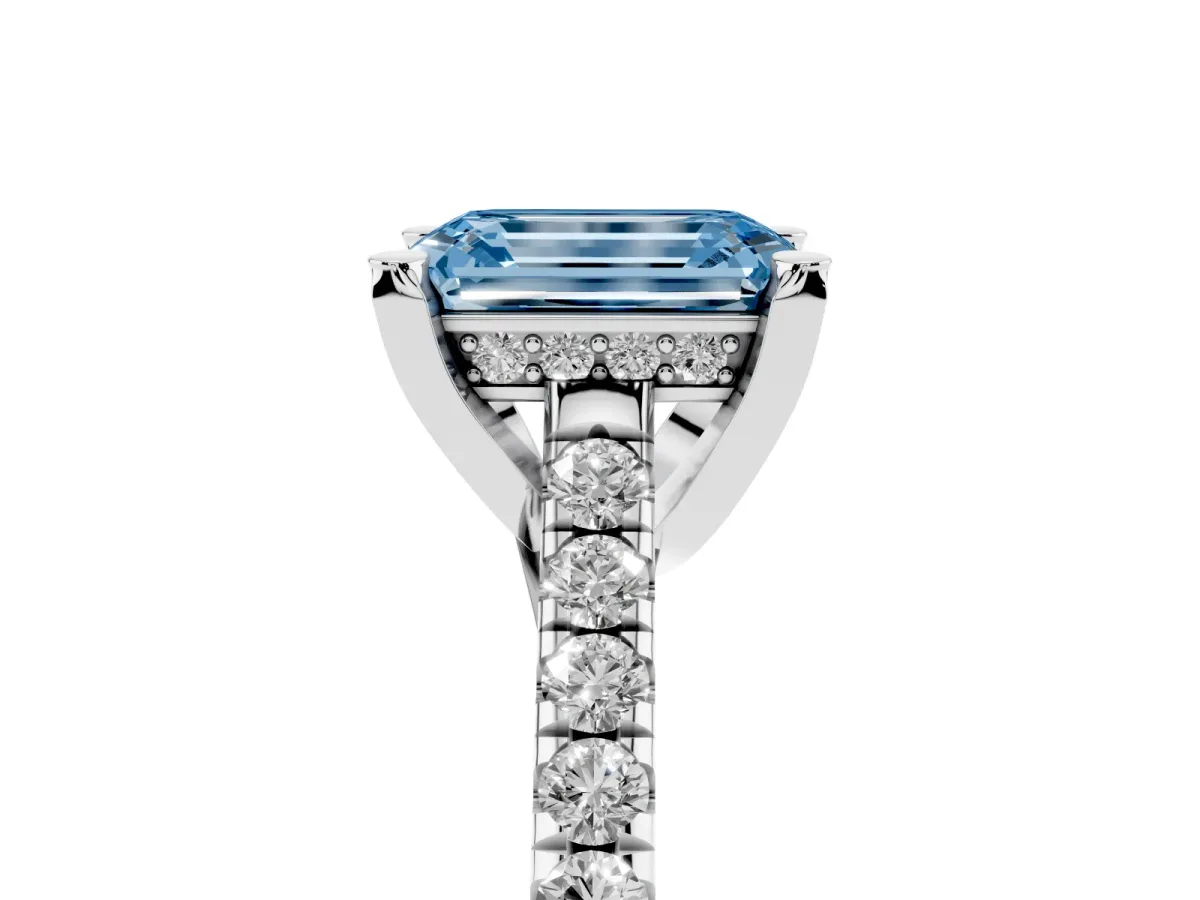 Fancy Blue Emerald Cut Brilliant Diamond Solitaire with Pavé Band and Four-Prong Setting Platinum