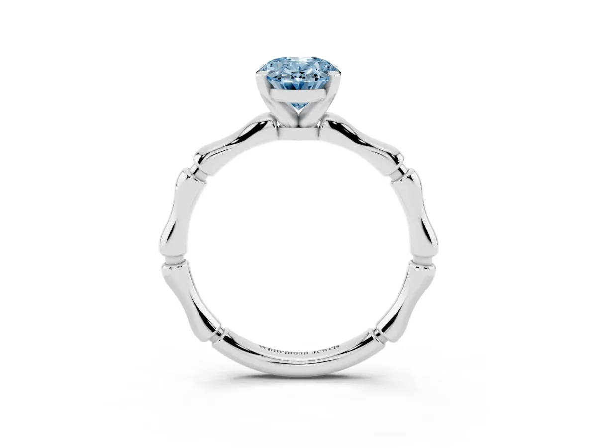 Fancy Blue Oval Cut Solitaire Diamond Ring with Bamboo Band and Four-Prong Setting Silver