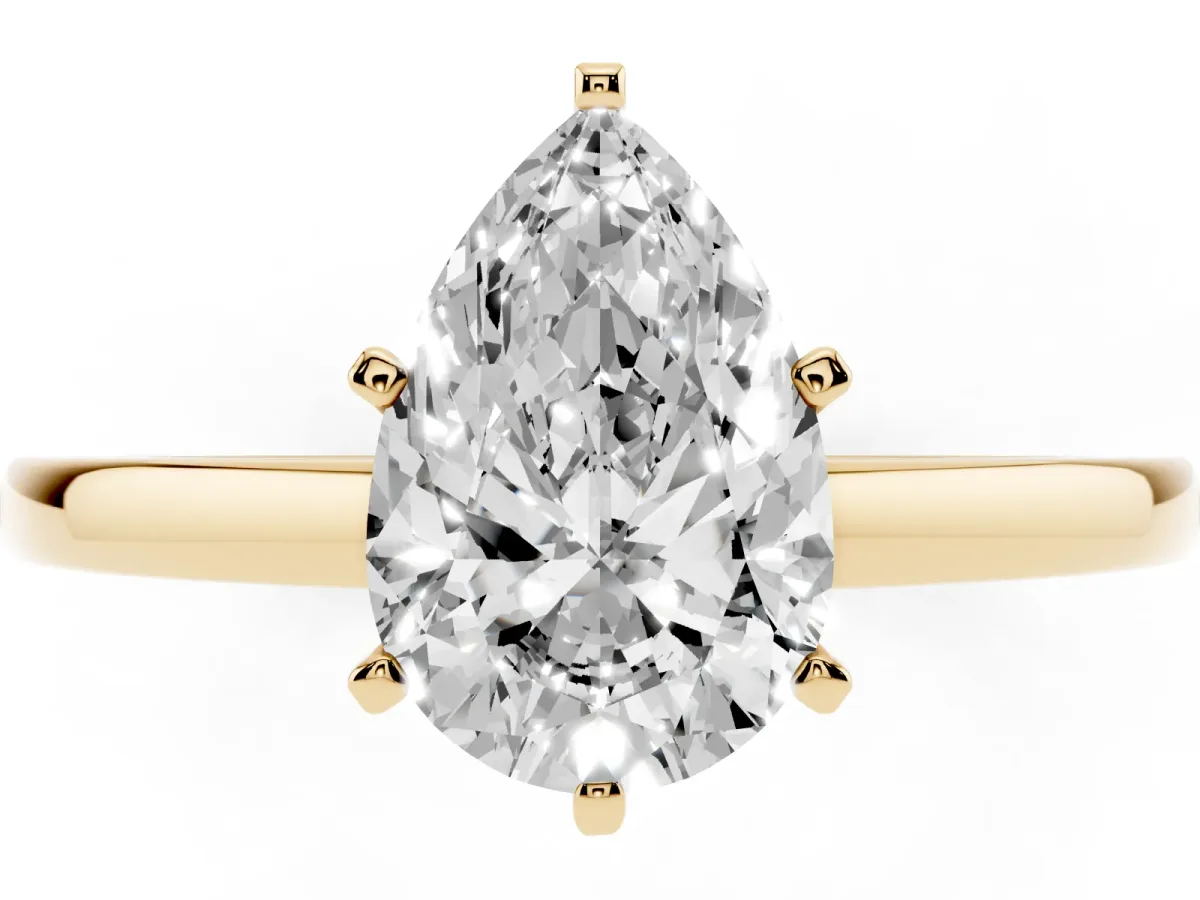 Pear Cut Solitaire Diamond Engagement Ring with Four-Prong Setting on a Classic Band Yellow gold