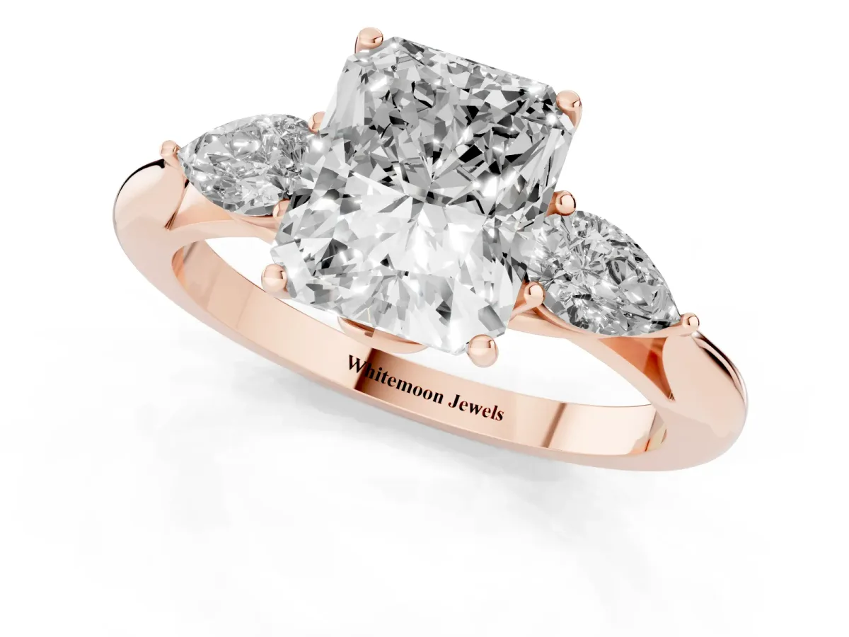Three-Stone Radiant Cut Diamond Ring with Pear Side Stones in Four-Prong Setting Rose gold