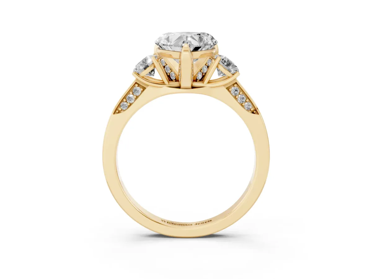 Heart Cut Brilliant Three-Stone Diamond Ring with Pavé Band and Four-Prong Setting Yellow gold
