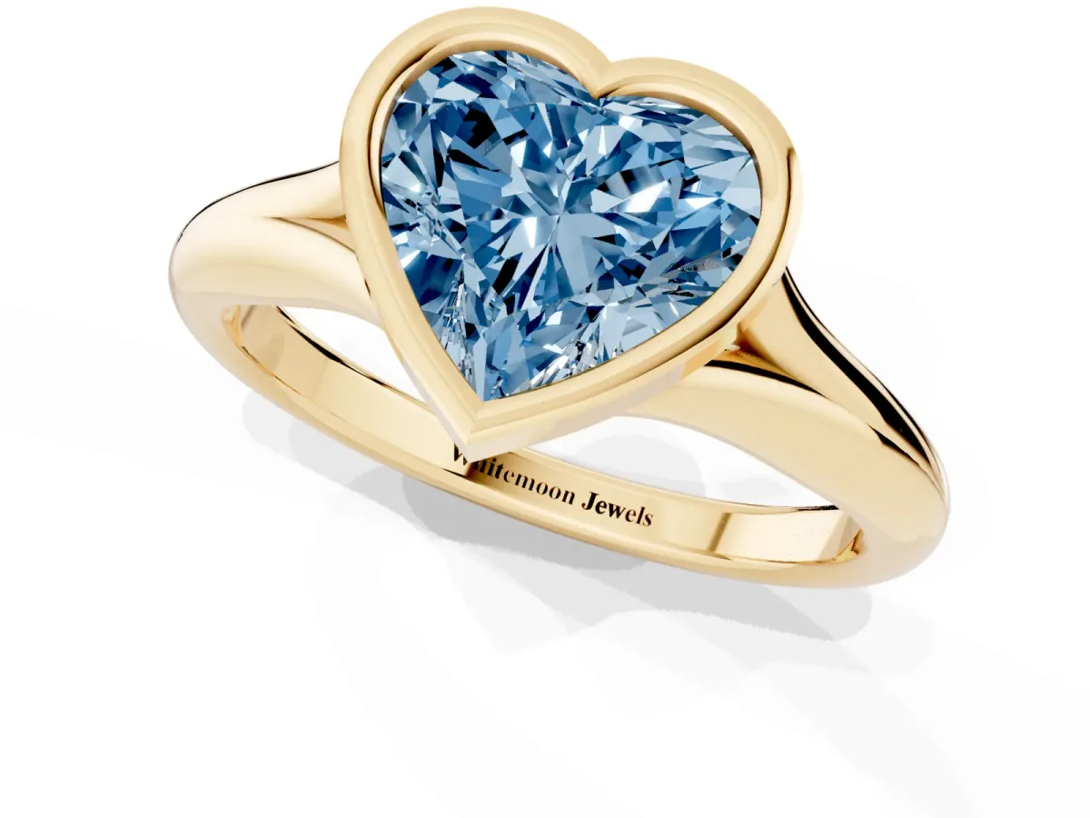 Fancy Blue Bezel Set Heart Cut Solitaire Diamond Ring with Smooth Band Yellow gold