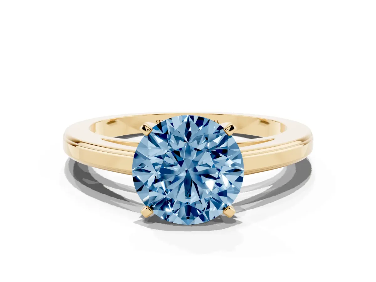 Fancy Blue Round Cut Solitaire Diamond Ring with Four-Prong Setting and Classic Band Yellow gold