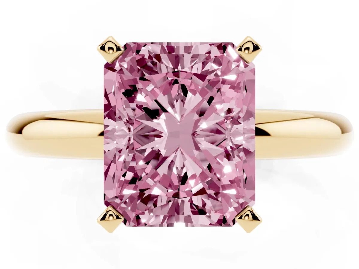 Fancy Pink Radiant Cut Diamond Solitaire Engagement Ring with Round Band and Four-Prong Setting Yellow gold