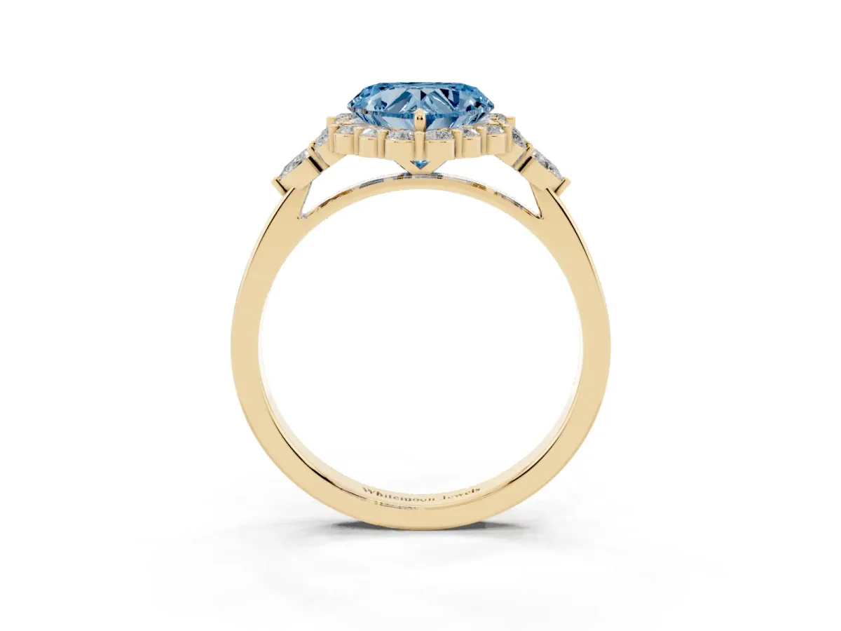 Fancy Blue Heart Cut Diamond Halo Ring with Pear Side Stones and Prong Setting Yellow gold