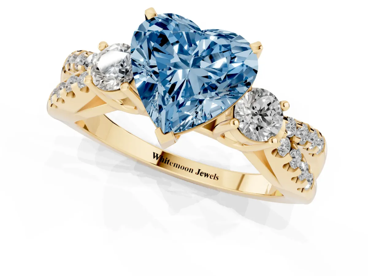 Fancy Blue Heart Cut Diamond Three-Stone Ring with Pavé Split Shank and Four-Prong Setting Yellow gold