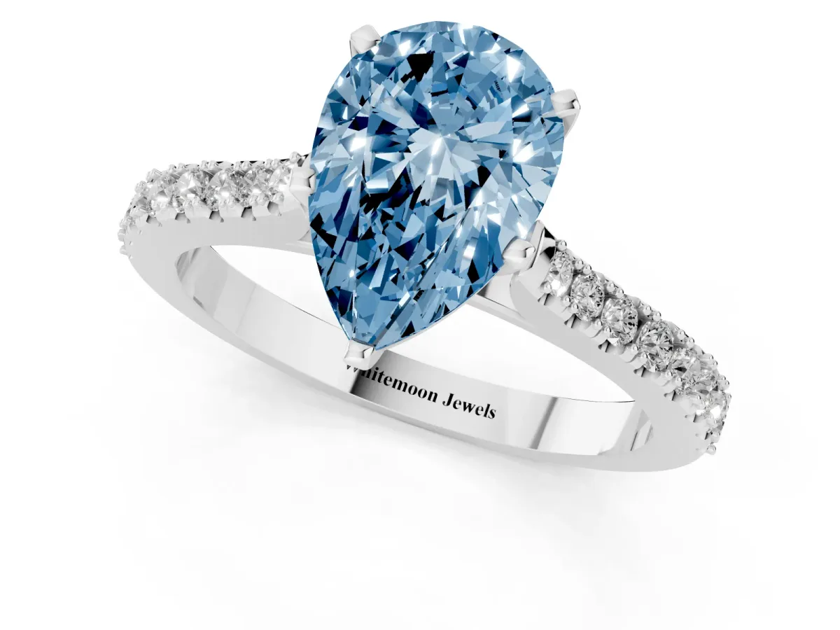 Fancy Blue Pear Cut Cut Solitaire Diamond Engagement Ring with Pave Band and Four-Prong Setting Silver