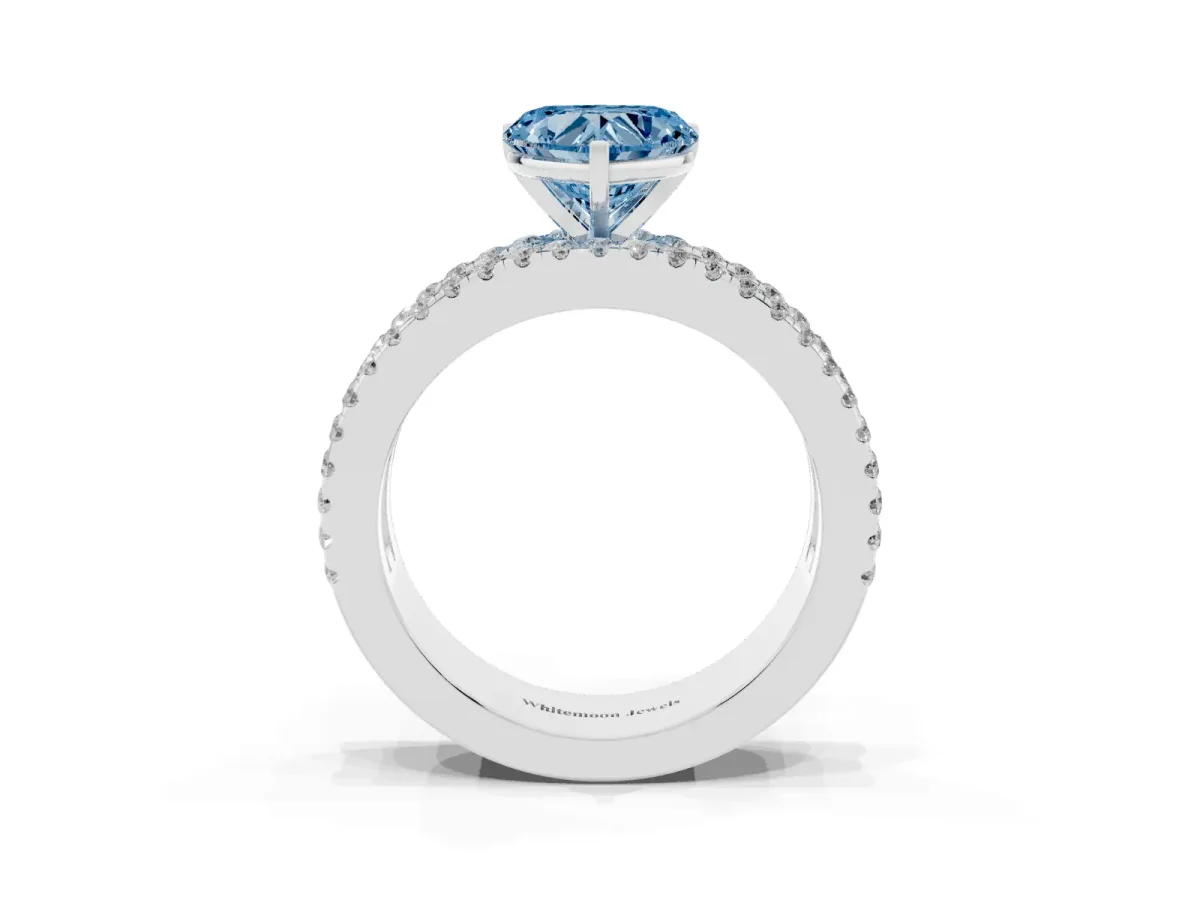 Fancy Blue Heart Cut Diamond Solitaire Ring with Pavé and Channel Set Band Platinum