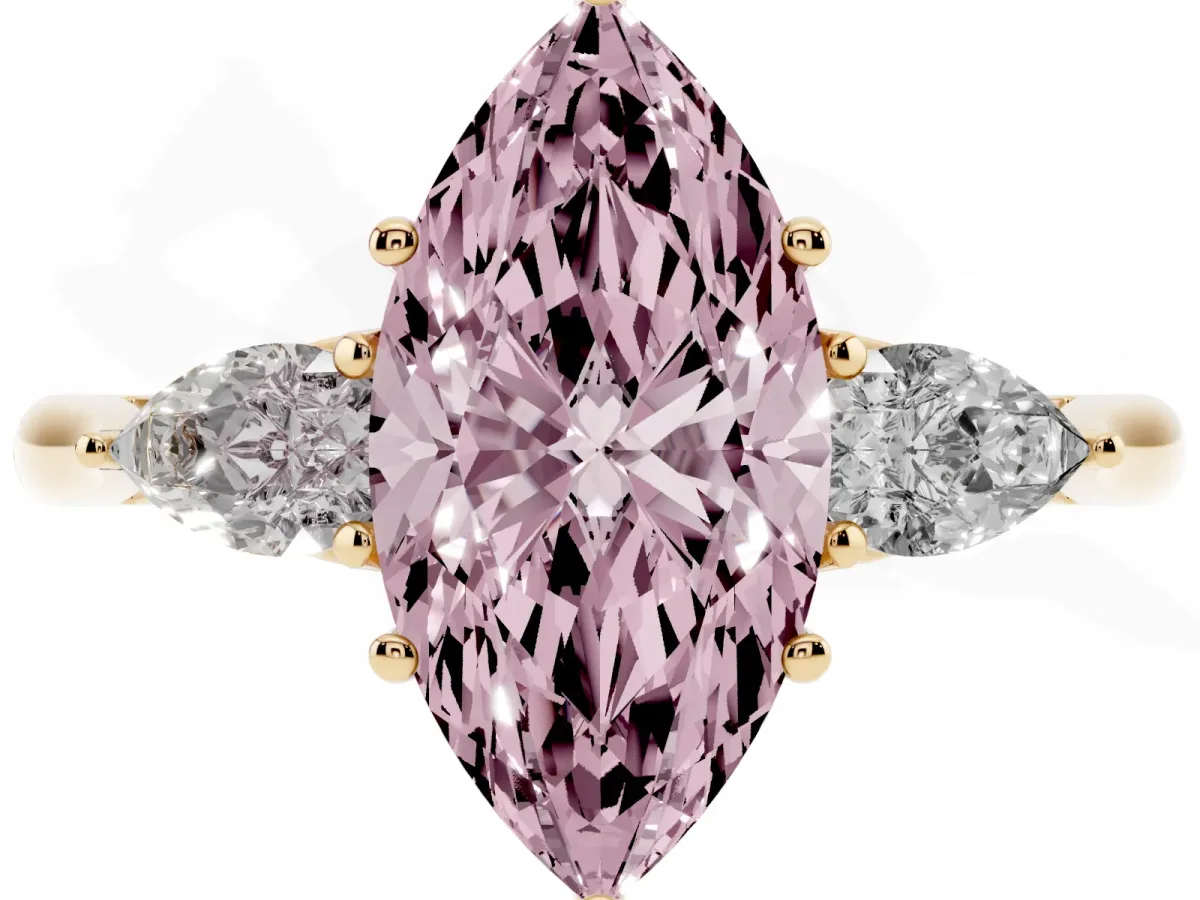 Fancy Pink Three-Stone Marquise Cut Diamond Ring with Pear Side Stones in Four-Prong Setting Yellow gold