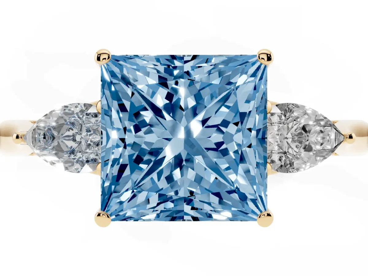 Fancy Blue Princess Cut Diamond Three-Stone Ring with Pear Side Stones and Prong Setting Yellow gold