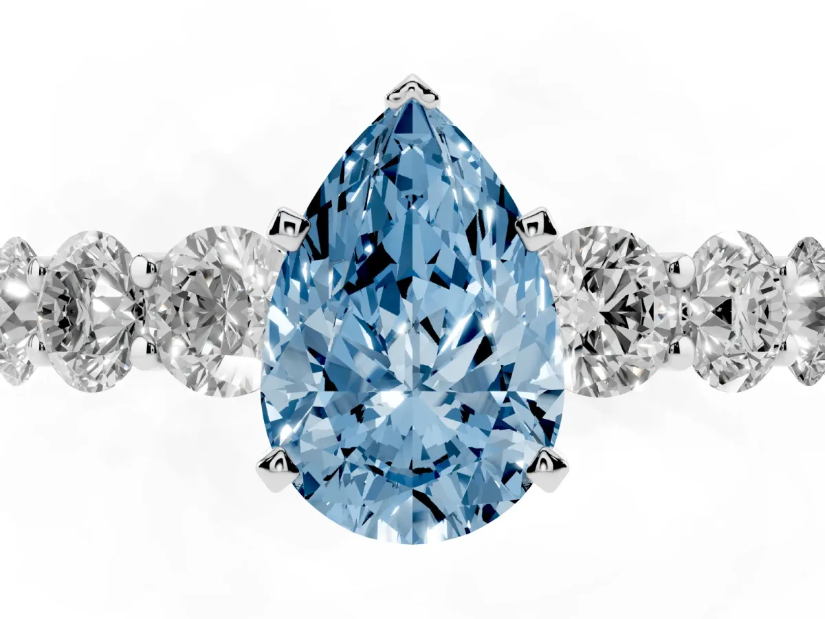 Fancy Blue Pear Cut Diamond Prong Setting with Side Stones on a Pave Band Platinum