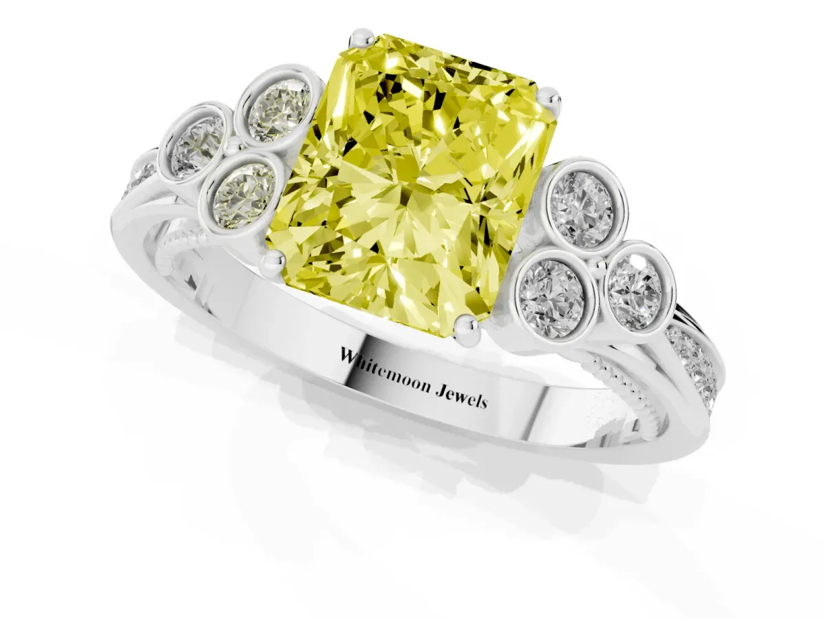 Fancy Yellow Radiant Cut Cut Diamond Engagement Ring with Bezel Set Round Side Stones and Prong Setting Platinum
