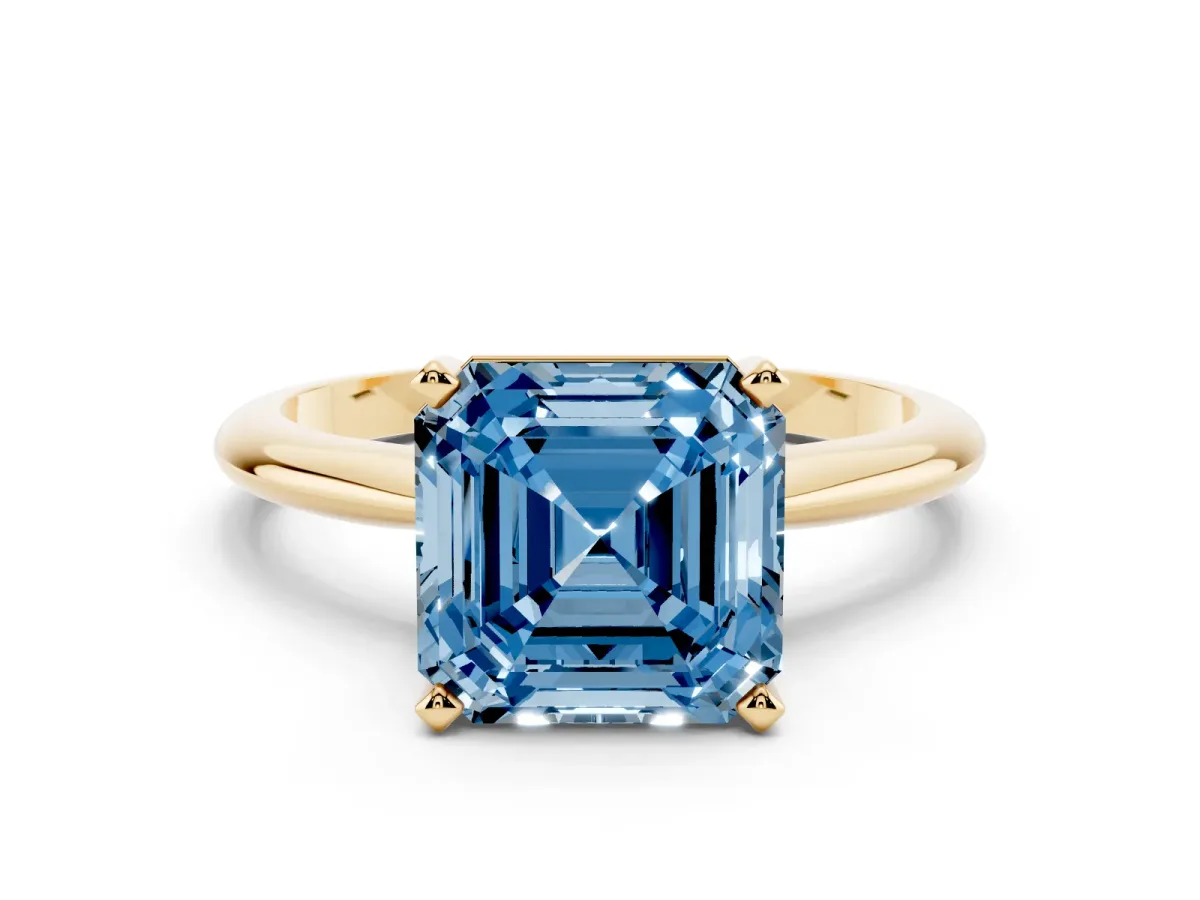 Fancy Blue Asscher Cut Cut Solitaire Ring with Four-Prong Setting on a Classic Band Yellow gold