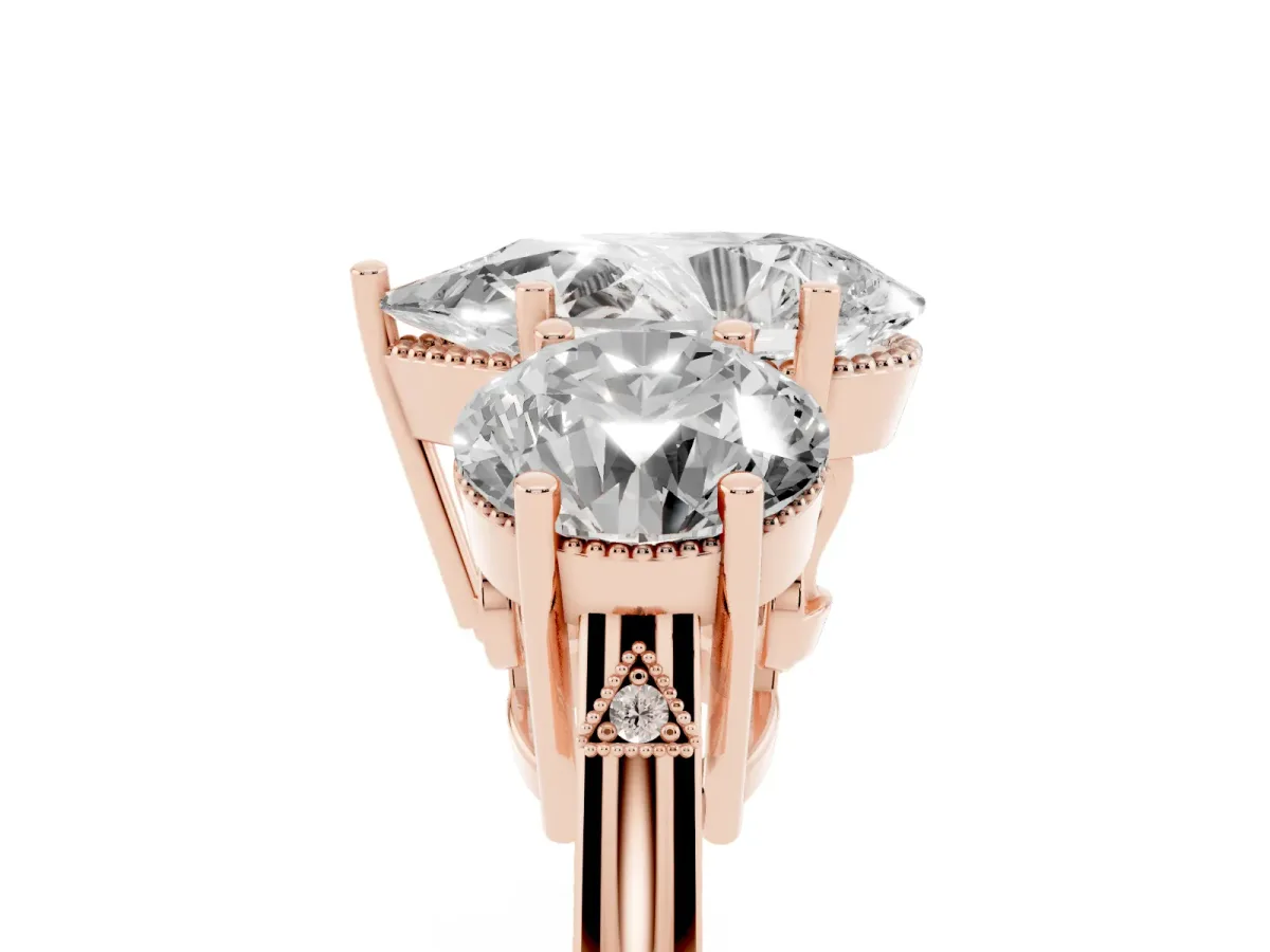 Three-Stone Pear Cut Diamond Engagement Ring with Prong Setting on a Classic Band Rose gold