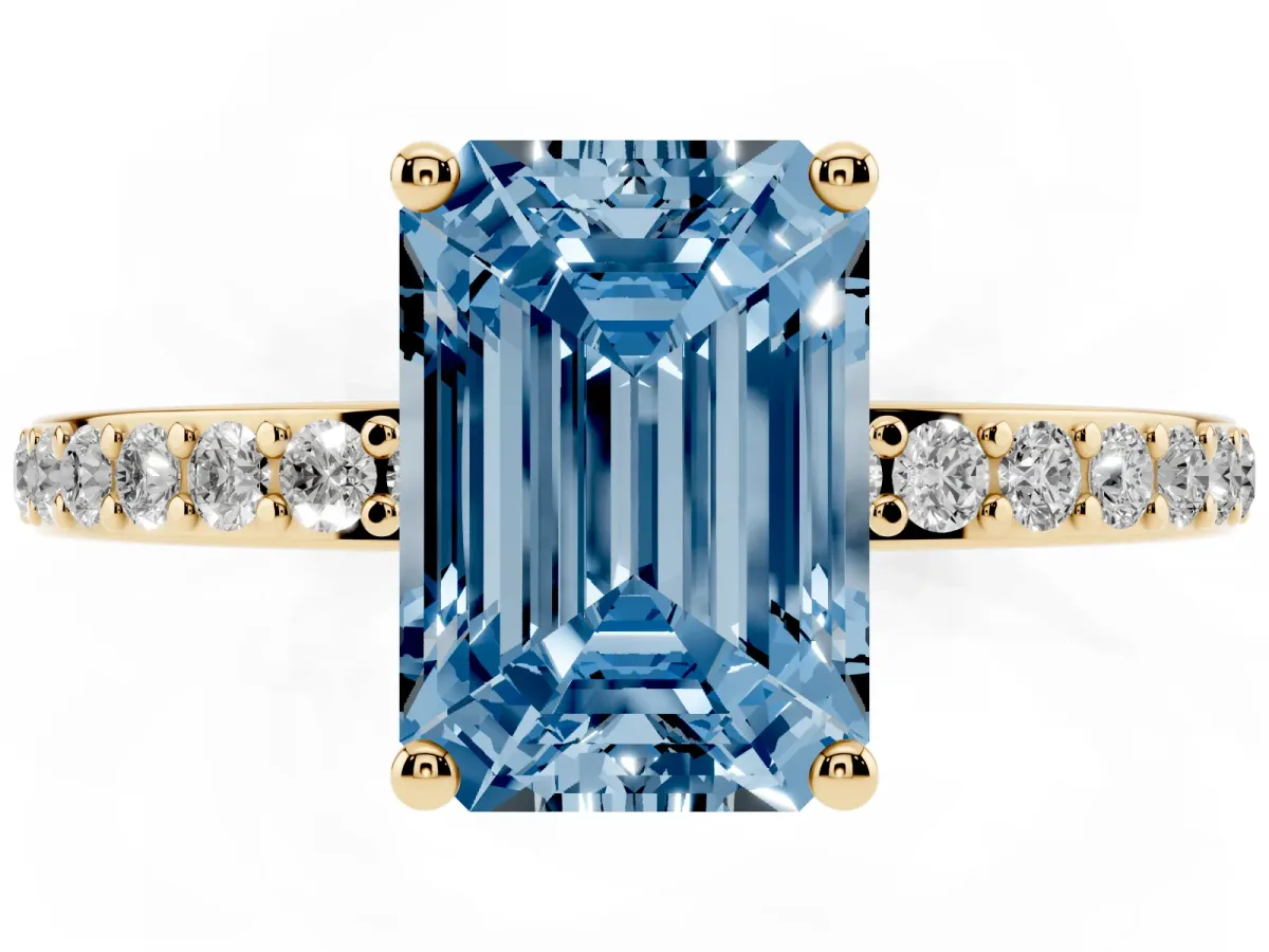 Fancy Blue Emerald Cut Cut Diamond Pavé Band Ring with Four-Prong Setting Yellow gold