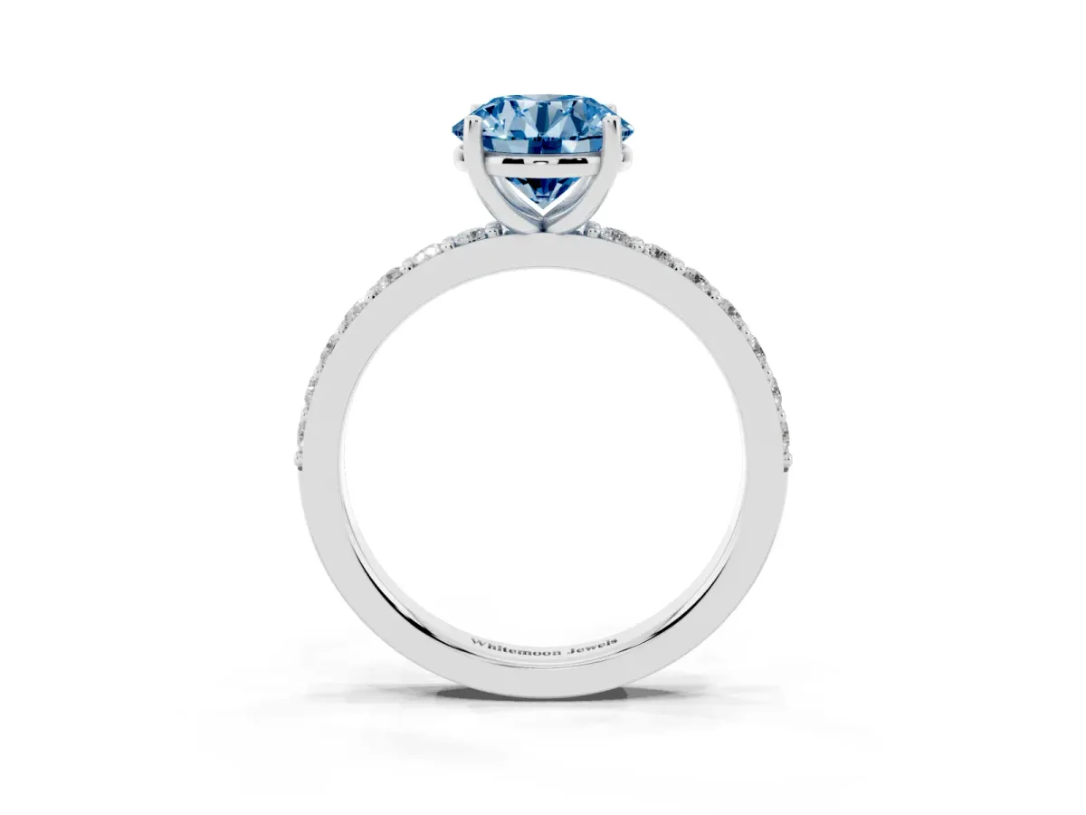 Fancy Blue Round Cut Cut Diamond Solitaire with Pave Band and Four-Prong Setting Silver