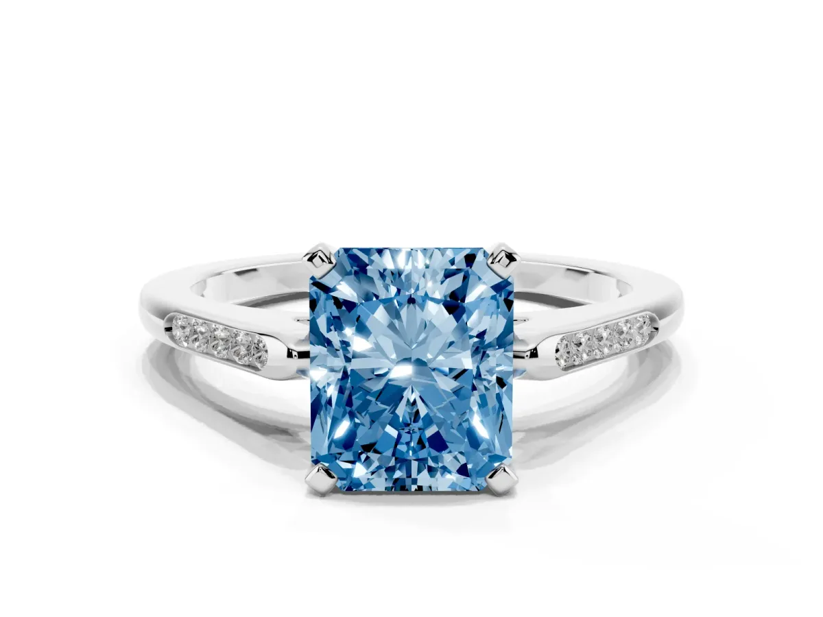 Fancy Blue Radiant Cut Diamond Solitaire Ring with Channel Set Round Band and Prong Setting Silver