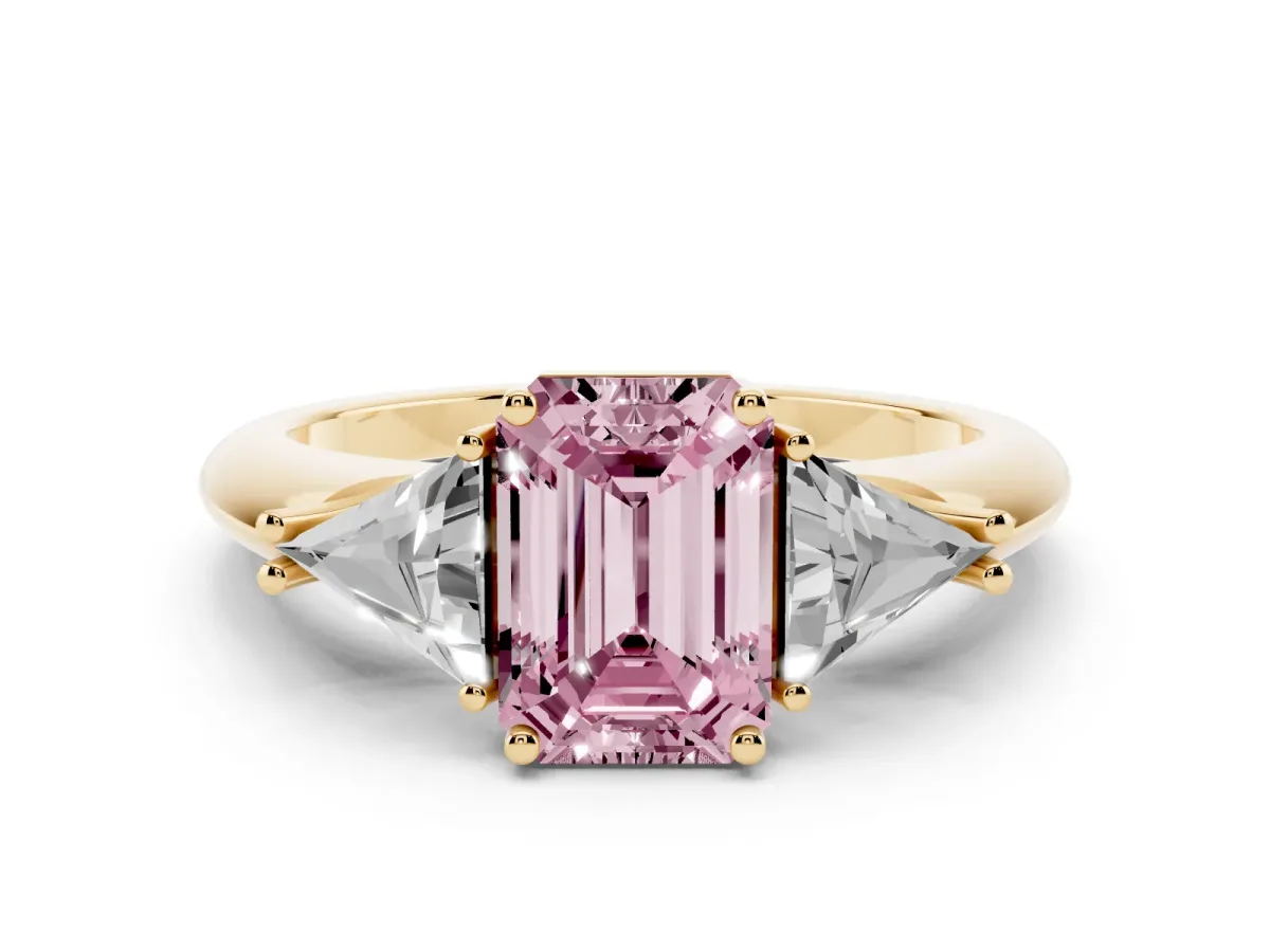 Fancy Pink Three-Stone Emerald Cut Diamond Engagement Ring with Trillion Side Stones and Prong Setting Yellow gold