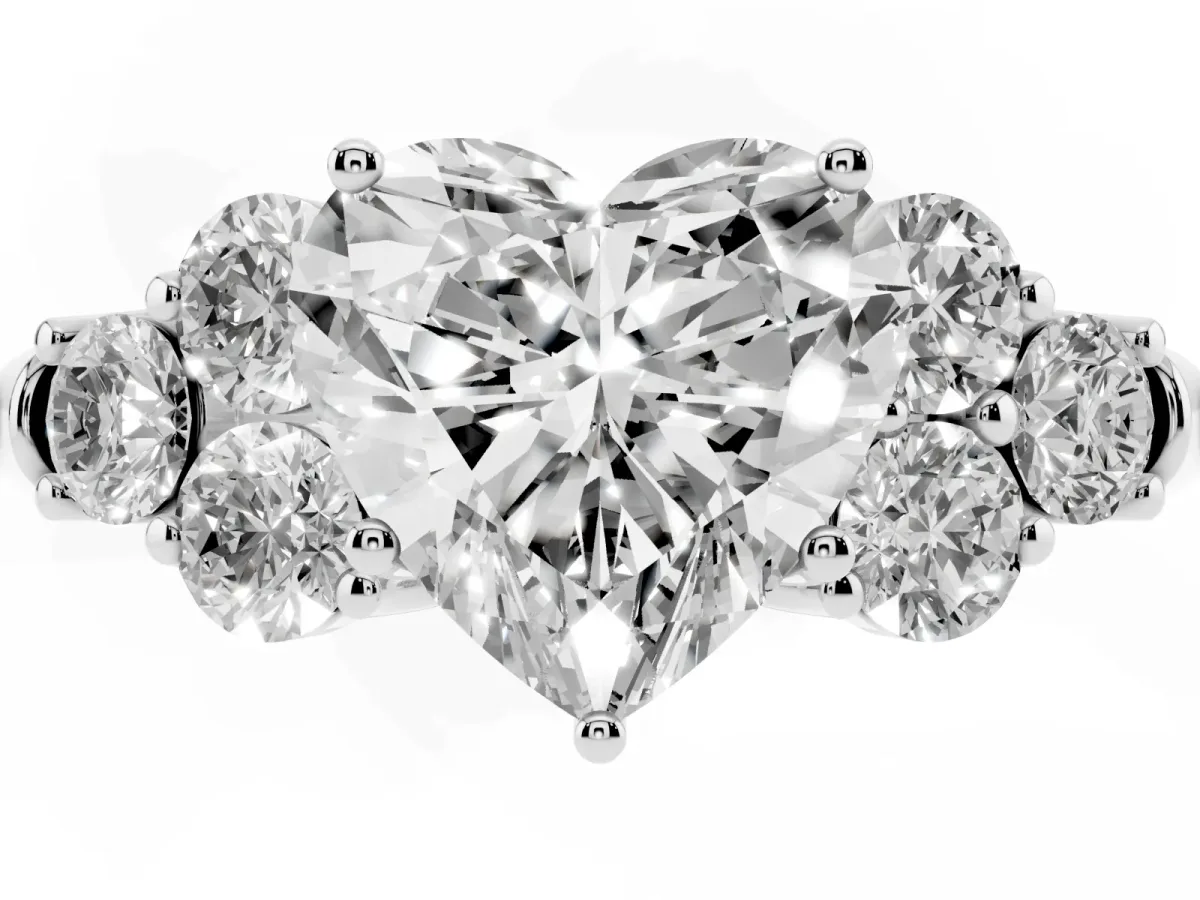 Heart Cut Cut Diamond Cluster Ring with Round Accent Stones and Prong Setting on a Classic Band White gold