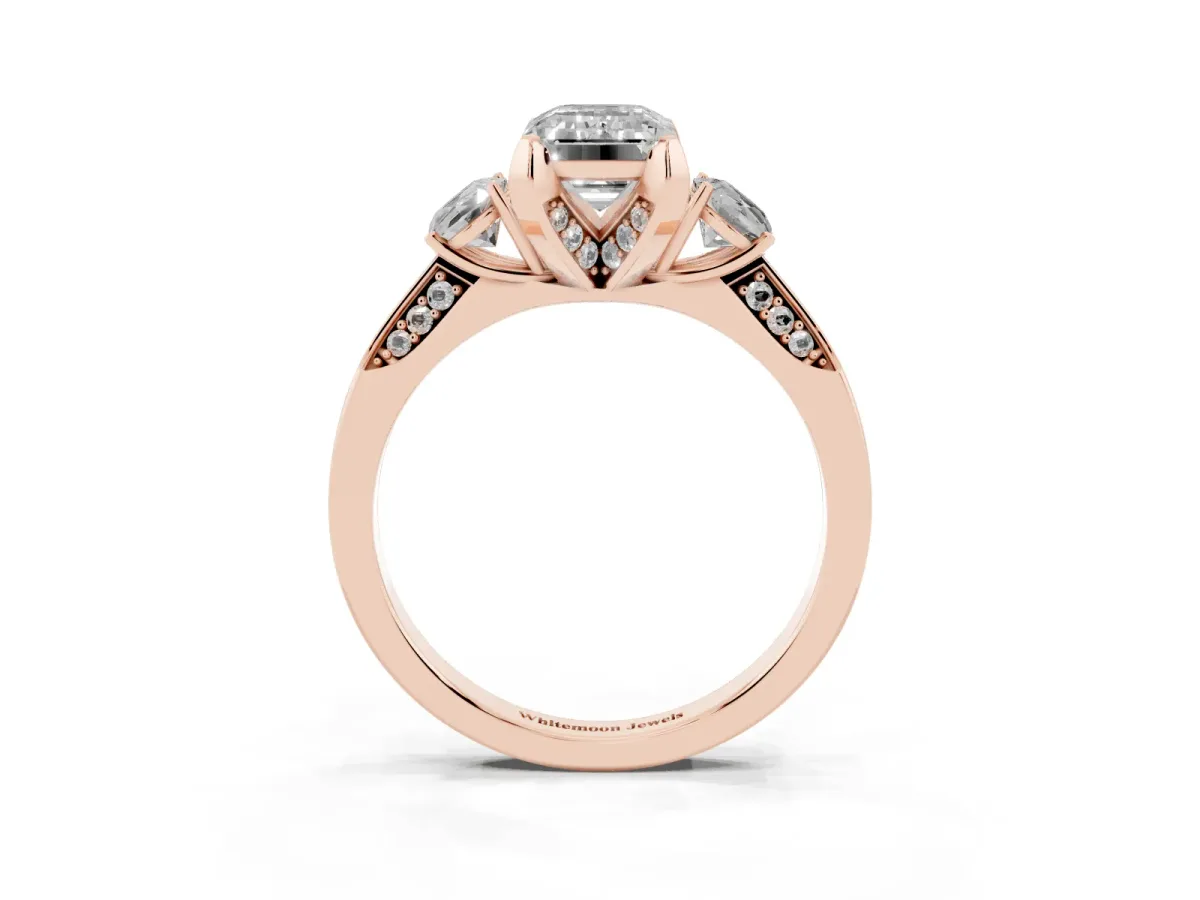 Fancy Pink Emerald Cut Brilliant Three-Stone Diamond Ring with Pavé Band and Four-Prong Setting Rose gold