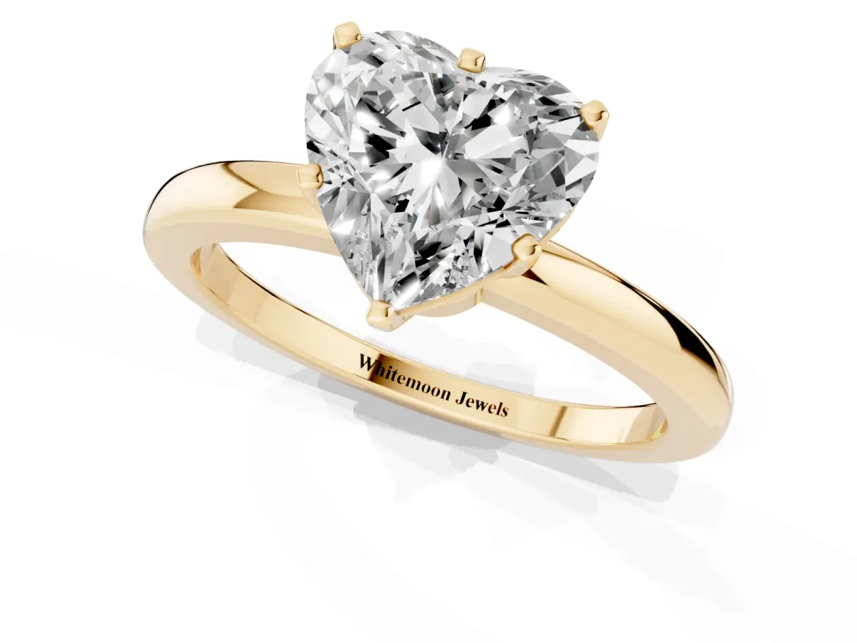 Heart Cut Solitaire Diamond Ring with Six-Prong Setting on a Classic Band Yellow gold