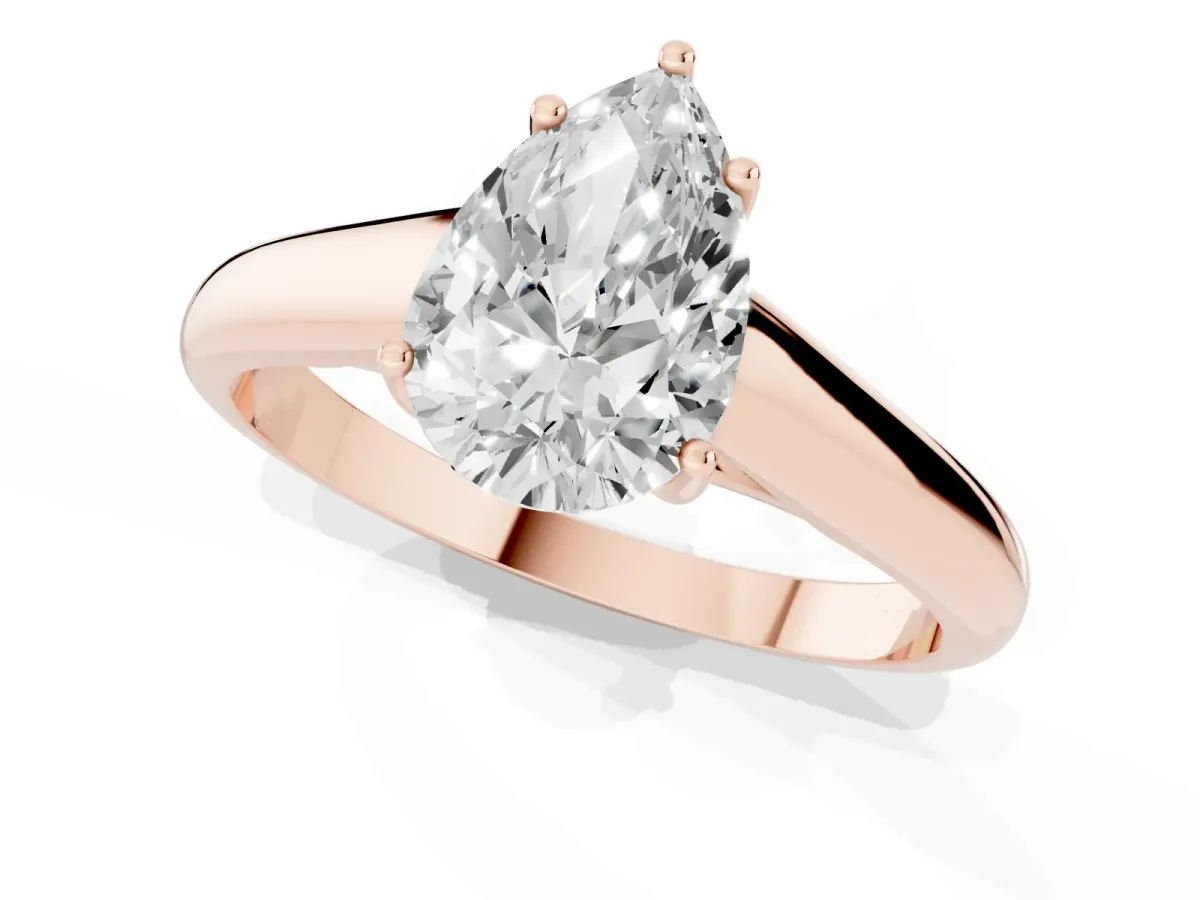 Pear Cut Solitaire Engagement Ring with Tapered Band and Four-Prong Setting Rose gold