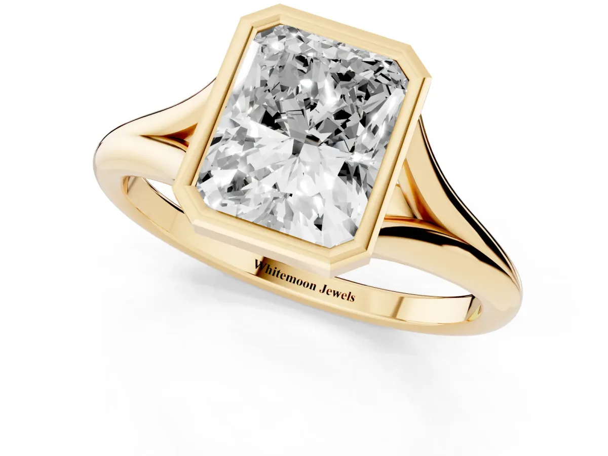 Bezel Set Radiant Cut Cut Solitaire Ring with Tapered Band Yellow gold