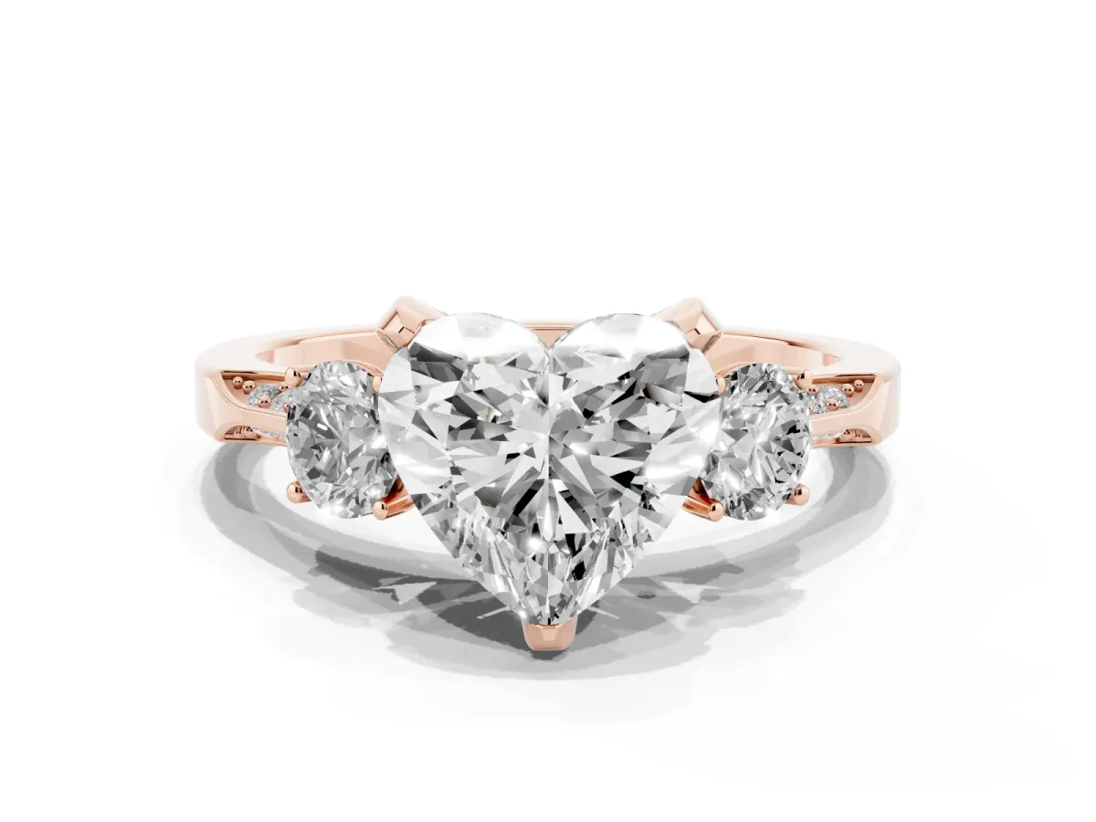 Heart Cut Brilliant Three-Stone Diamond Ring with Pavé Band and Four-Prong Setting Rose gold