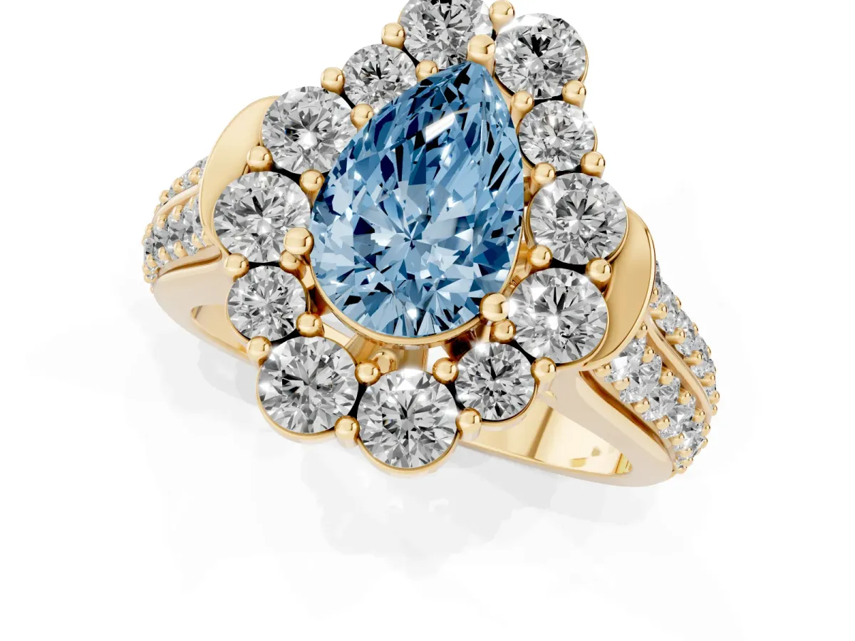 Fancy Blue Pear Cut Halo Diamond Engagement Ring with Split Shank and Prong Setting Yellow gold