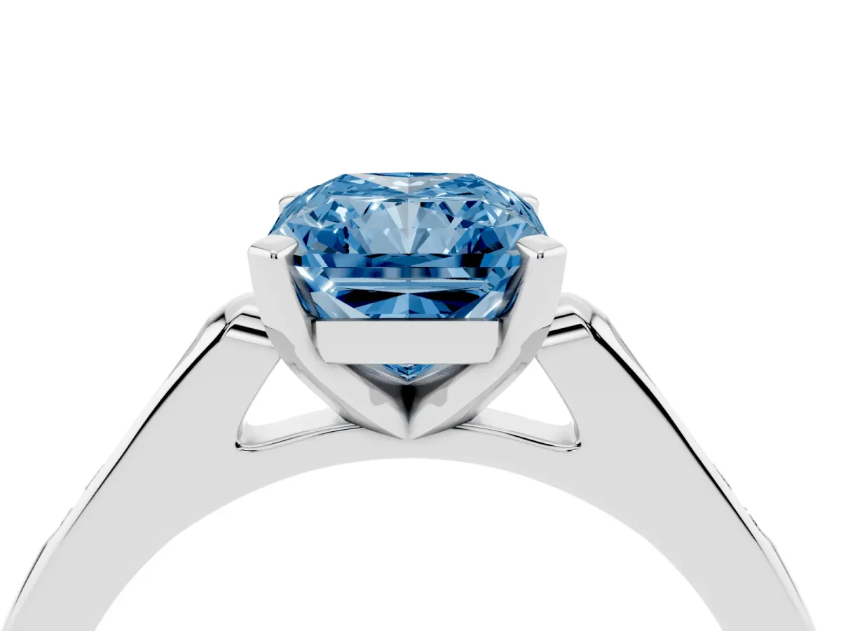 Fancy Blue Radiant Cut Diamond Solitaire Ring with Channel Set Round Band and Prong Setting Silver