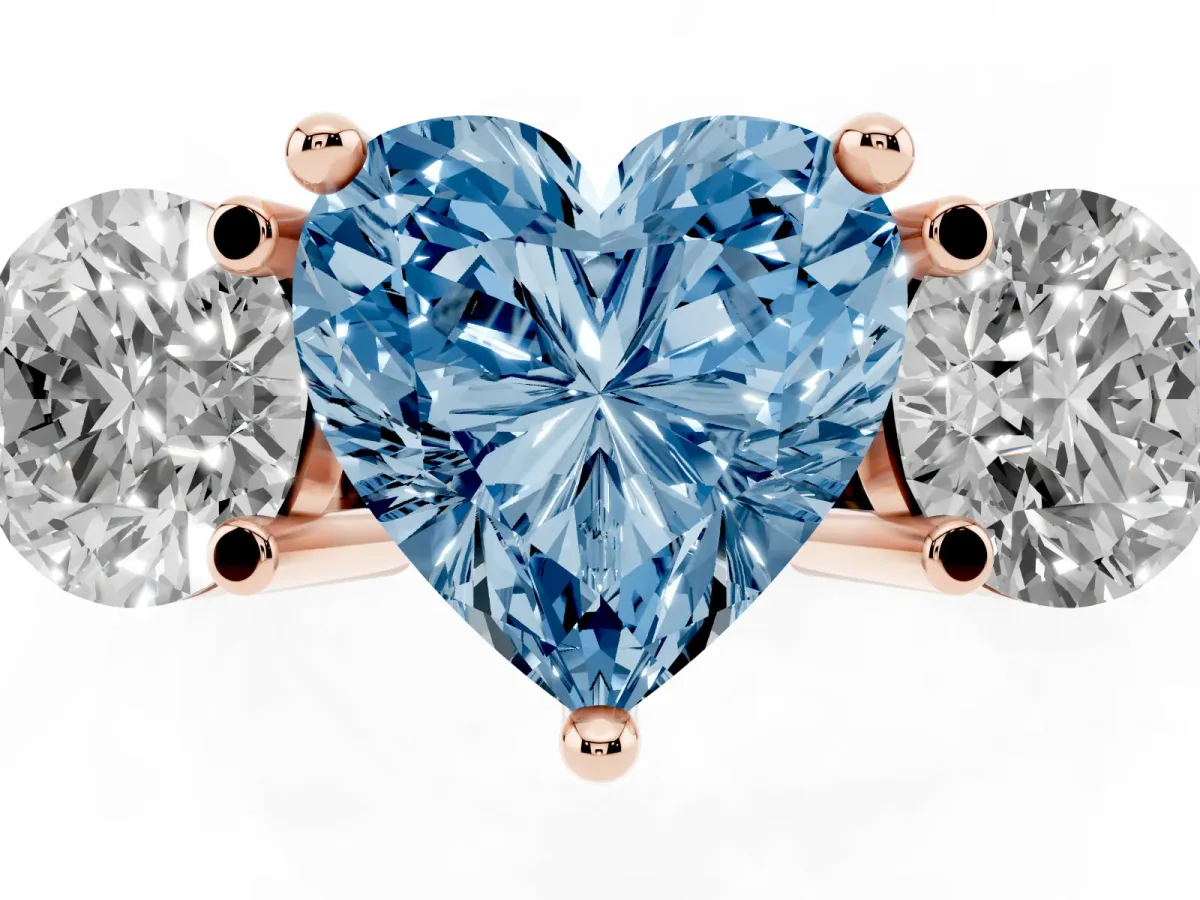 Fancy Blue Three-Stone Heart Cut Brilliant Cut Solitaire Ring with Prong Setting on a Classic Band Rose gold