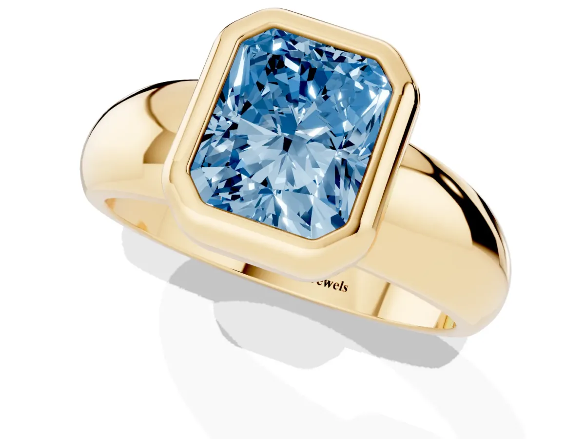 Fancy Blue Bezel Set Radiant Cut Solitaire Ring with Wide Band Yellow gold