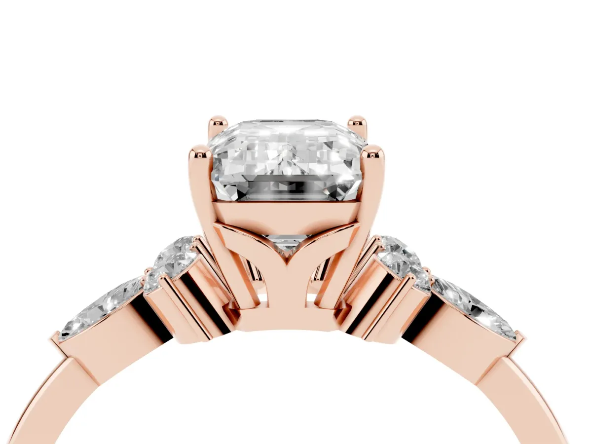 Emerald Cut Brilliant Diamond Solitaire Ring with Pear Side Stones and Four-Prong Setting Rose gold