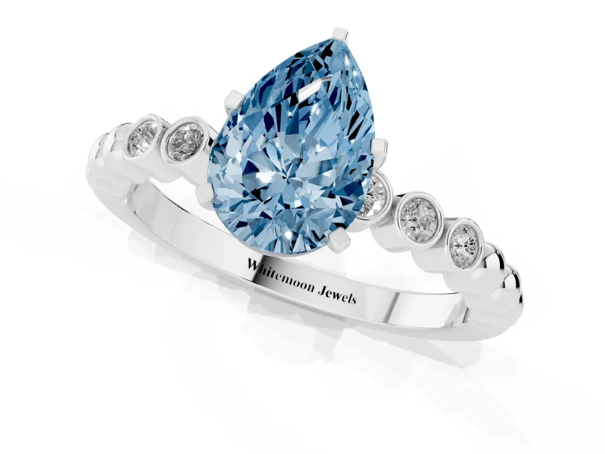 Fancy Blue Pear Cut Solitaire Bezel Accent Diamond Engagement Ring with Beaded Band and Four-Prong Setting White gold