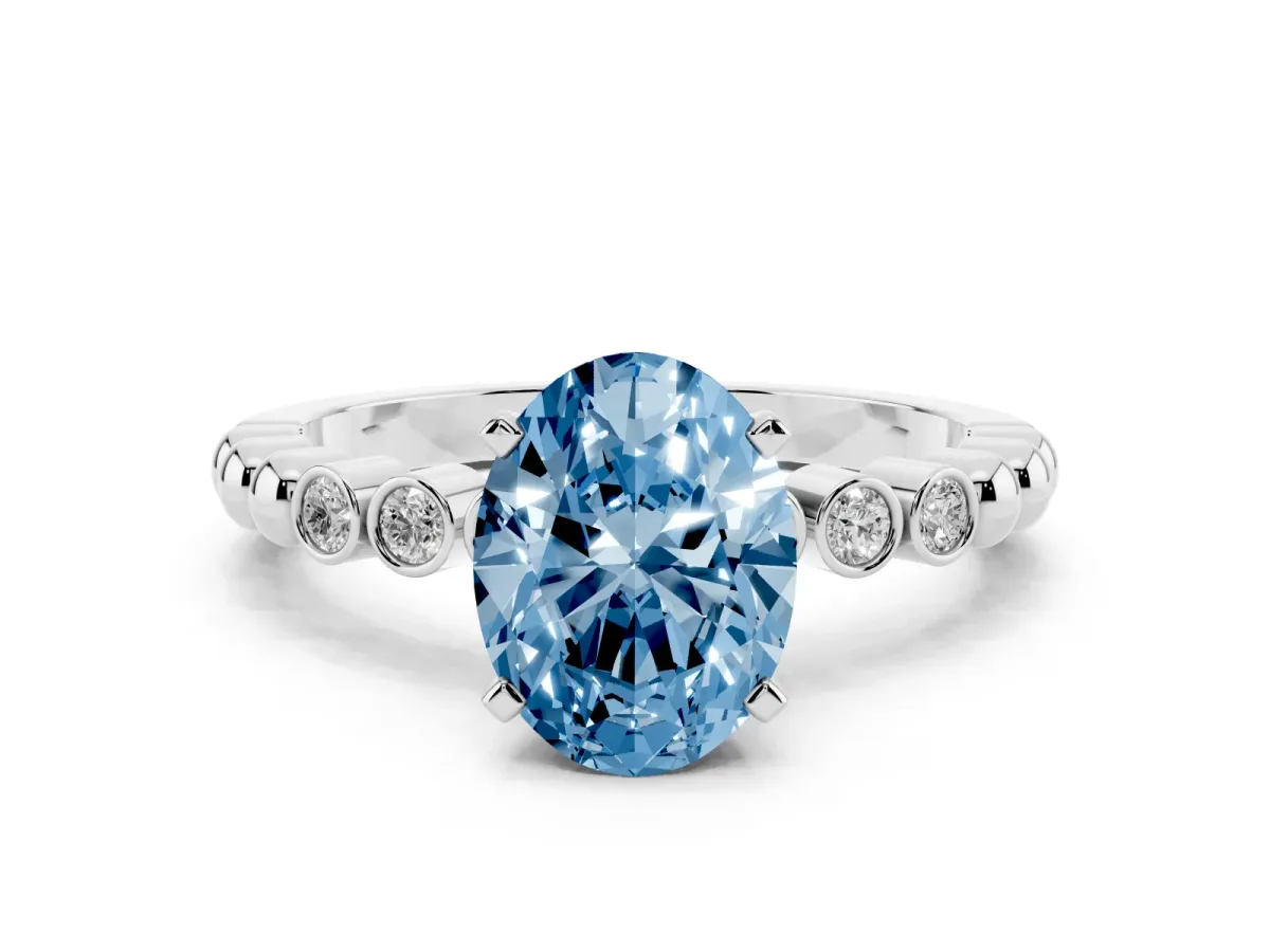 Fancy Blue Oval Cut Solitaire Bezel Accent Diamond Engagement Ring with Beaded Band and Four-Prong Setting White gold