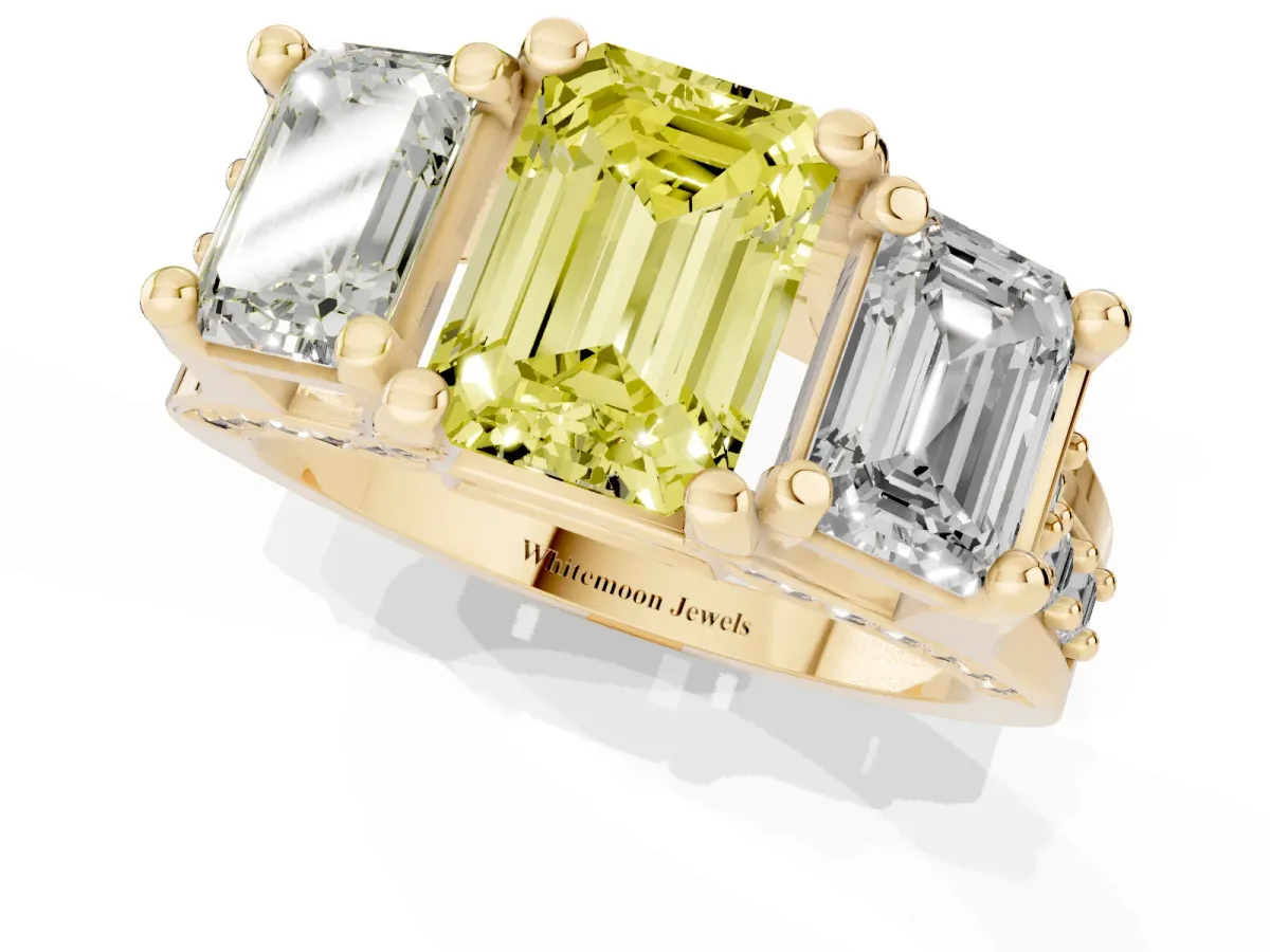 Fancy Yellow Emerald Cut Diamond Three-Stone Ring with Channel Set Band and Four-Prong Setting Yellow gold